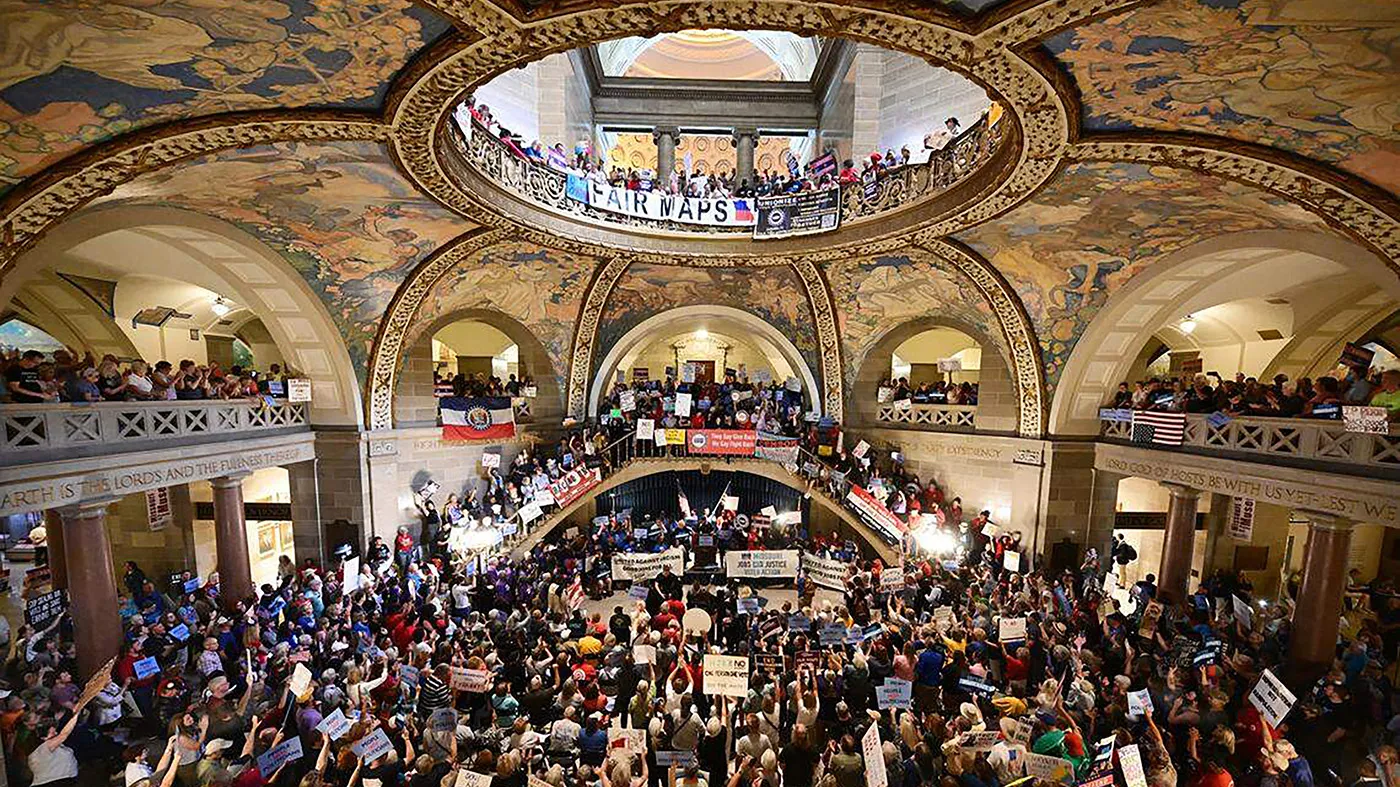 People gather at the Missouri statehouse in Jefferson City on Sept. 10, 2025, to protest the legislature’s efforts to change the state’s congressional district maps.