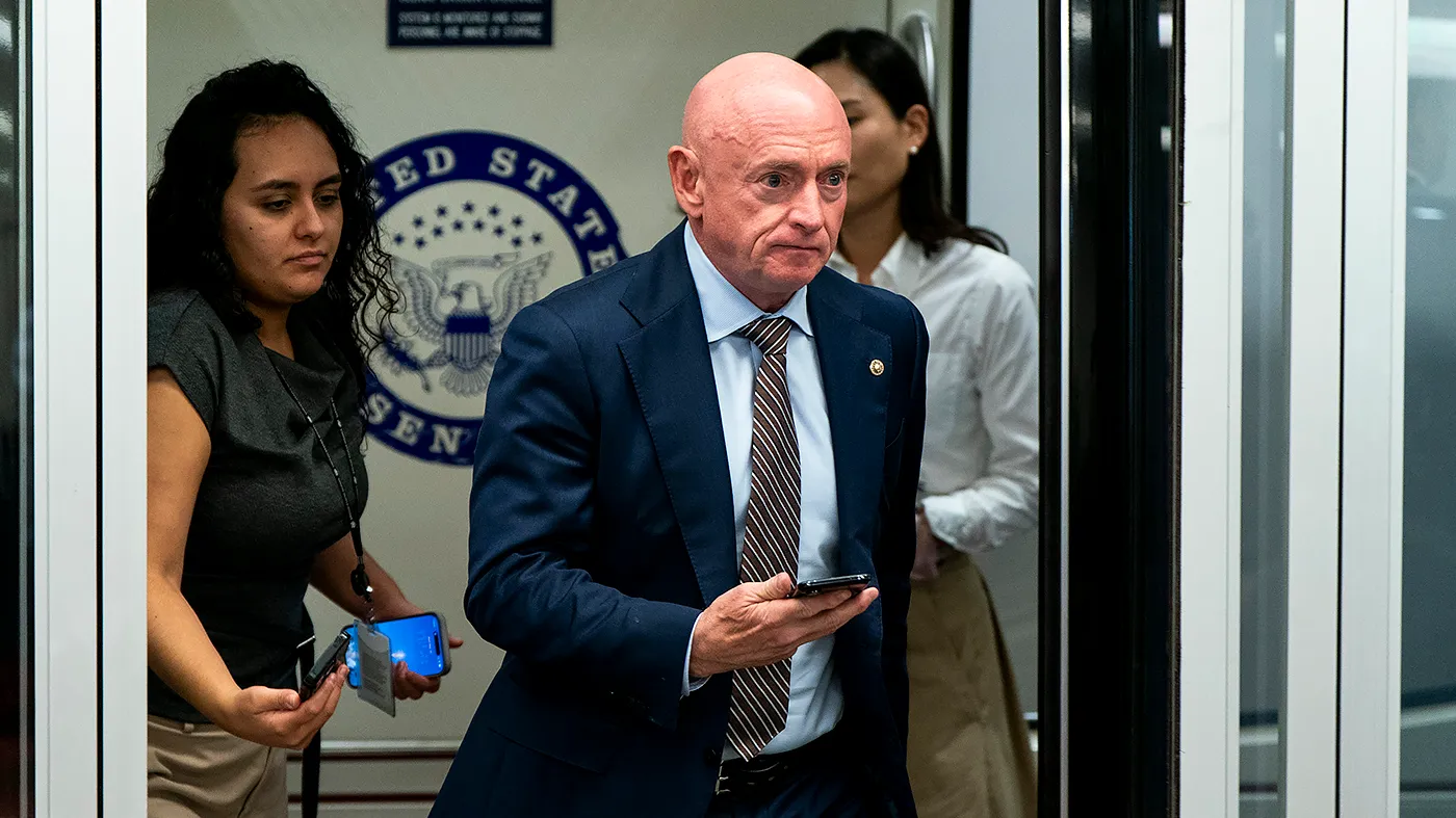 Sen. Mark Kelly (D-Ariz.) arrives to the Capitol for a series of votes on Sept. 30, 2026.