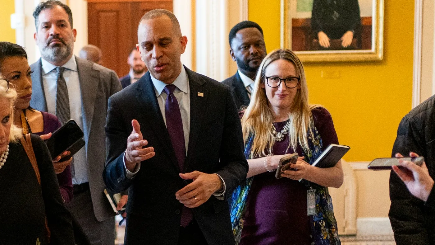 House Democratic Leader Hakeem Jeffries (N.Y.) walks with his communications director Christiana Stephenson.