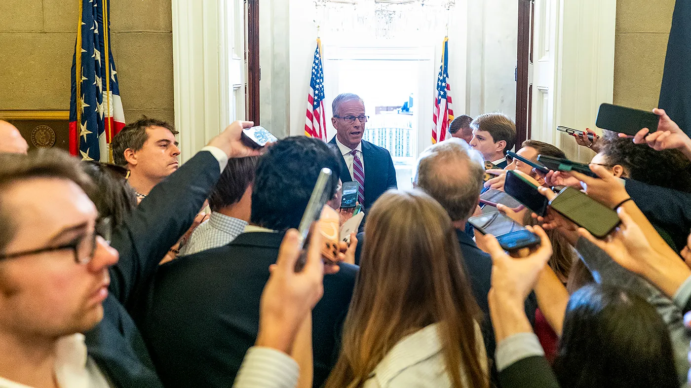 Senate Majority Leader John Thune (R-S.D.) talks to reporters as he returns to his office after speaking on the Senate Floor on Sept. 14, 2026.