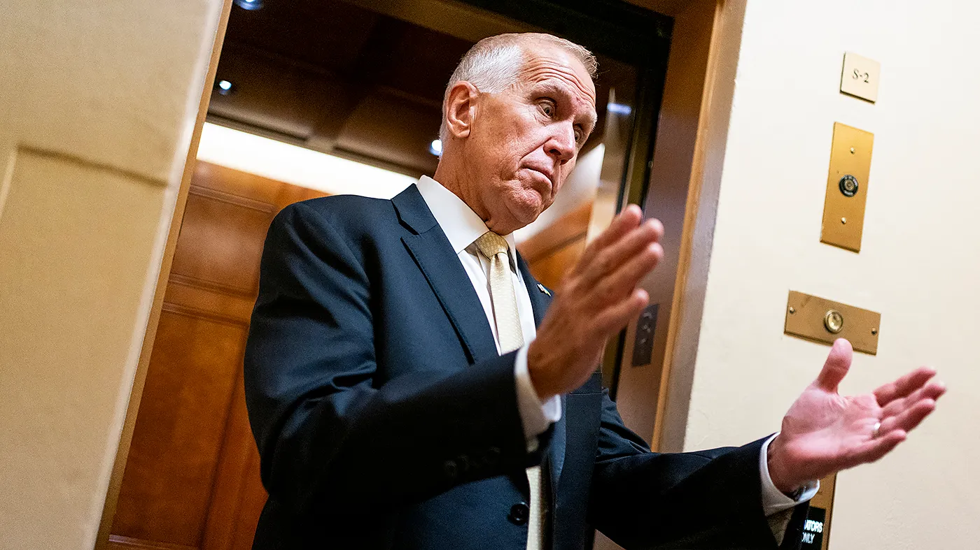 Sen. Thom Tillis (R-N.C.) gestures while speaking to reporters as he arrives to the Capitol for a series of votes on Wednesday, September 30, 2026.