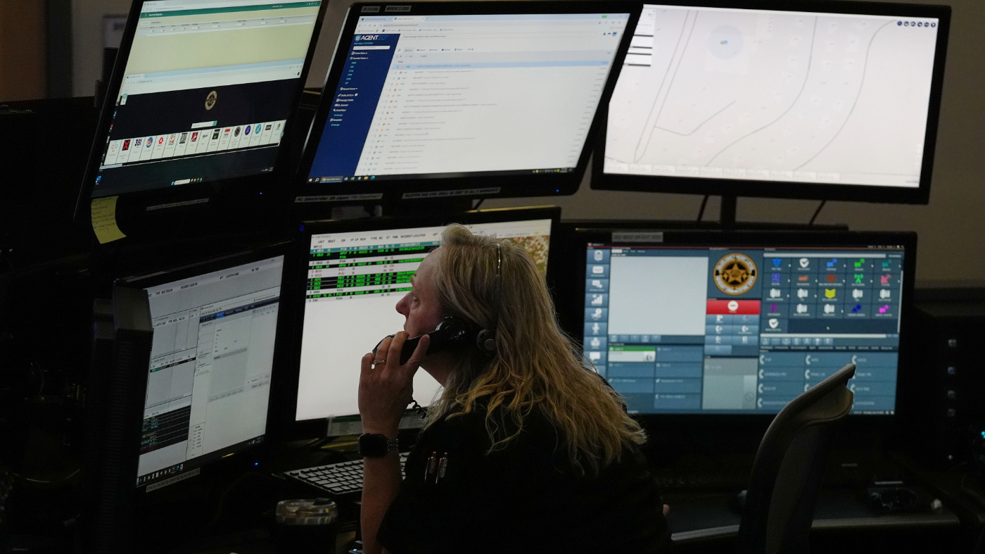Dispatcher Donna Bocik responds to a 911 call at the Collier County Emergency Services Center, Friday, July 11, 2025, in Naples, Fla. (AP Photo/Marta Lavandier)