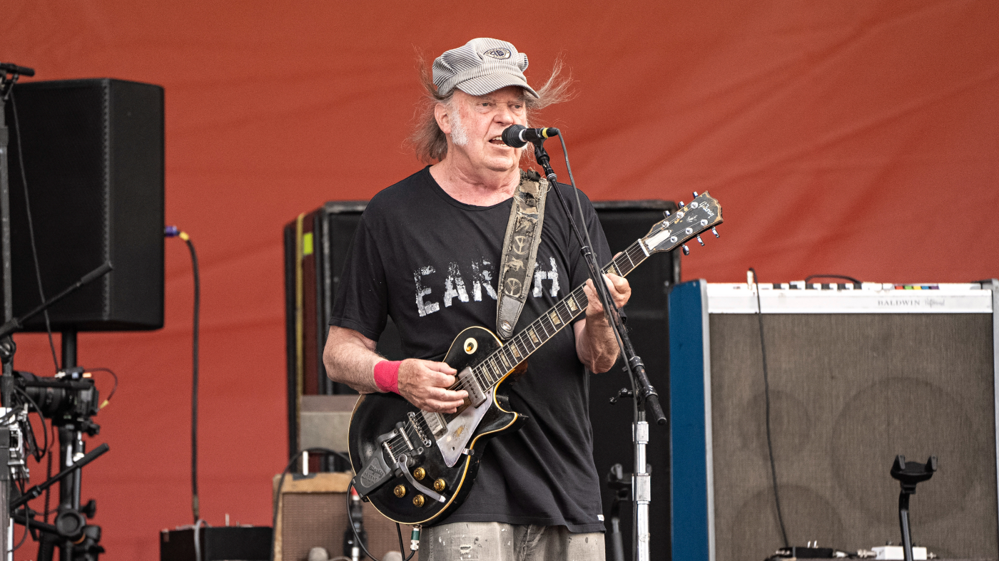 Neil Young, of Crazy Horse, performs during the New Orleans Jazz & Heritage Festival, May 4, 2024, at the Fair Grounds Race Course in New Orleans.