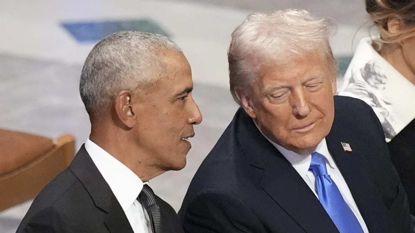 Former President Obama talks with President-elect Trump as Melania Trump reads the funeral program before the state funeral for former President Jimmy Carter at Washington National Cathedral in Washington, Jan. 9, 2025.