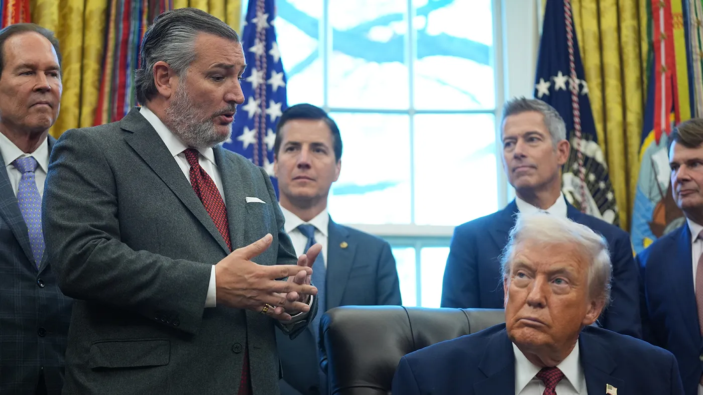 Sen. Ted Cruz (R-Texas) speaks as President Trump looks on, during an event on fuel economy standards in the Oval Office of the White House, Dec. 3, 2025, in Washington.
