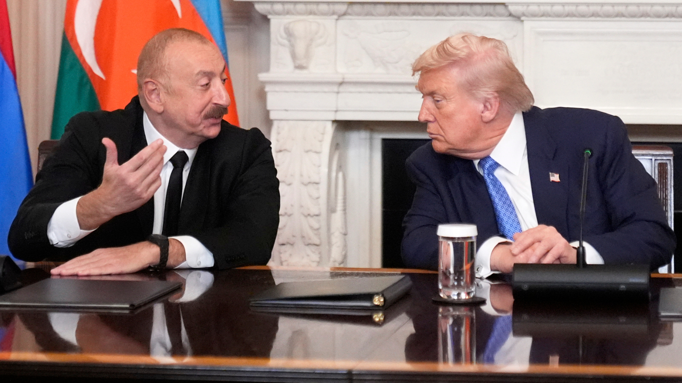 Azerbaijan’s President Ilham Aliyev, left, speaks during a trilateral signing ceremony with President Donald Trump, right, and Armenia’s Prime Minister Nikol Pashinyan in the State Dining Room of the White House, Friday, Aug. 8, 2025, in Washington. (AP Photo/Mark Schiefelbein)