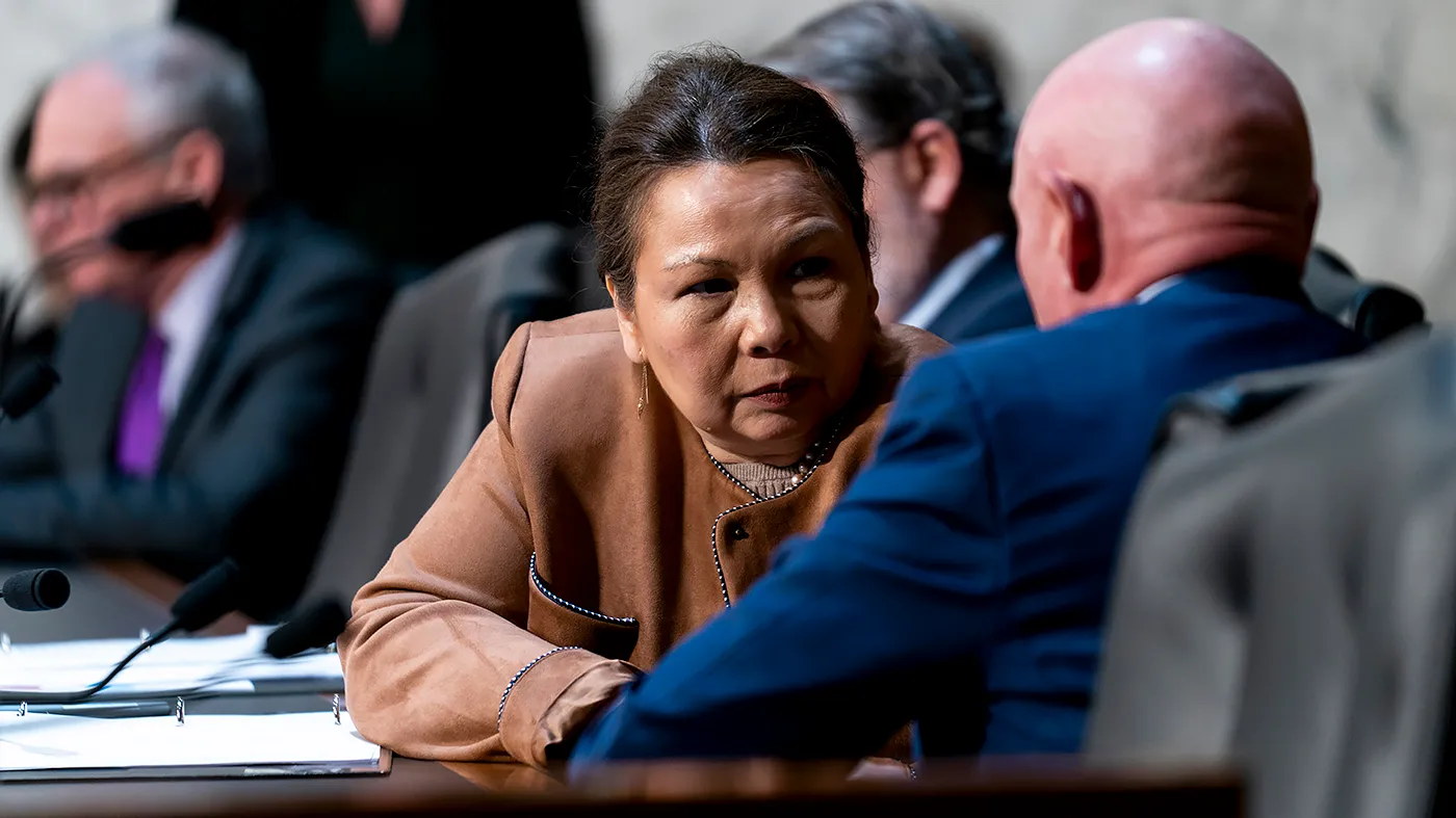Sen. Tammy Duckworth (D-Ill.) speaks with Sen. Mark Kelly (D-Ariz.) during a Senate Armed Services Committee hearing to discuss national defense strategy with Elbridge Colby, the undersecretary of Defense for Policy at the Department of Defense, on March 3, 2026.