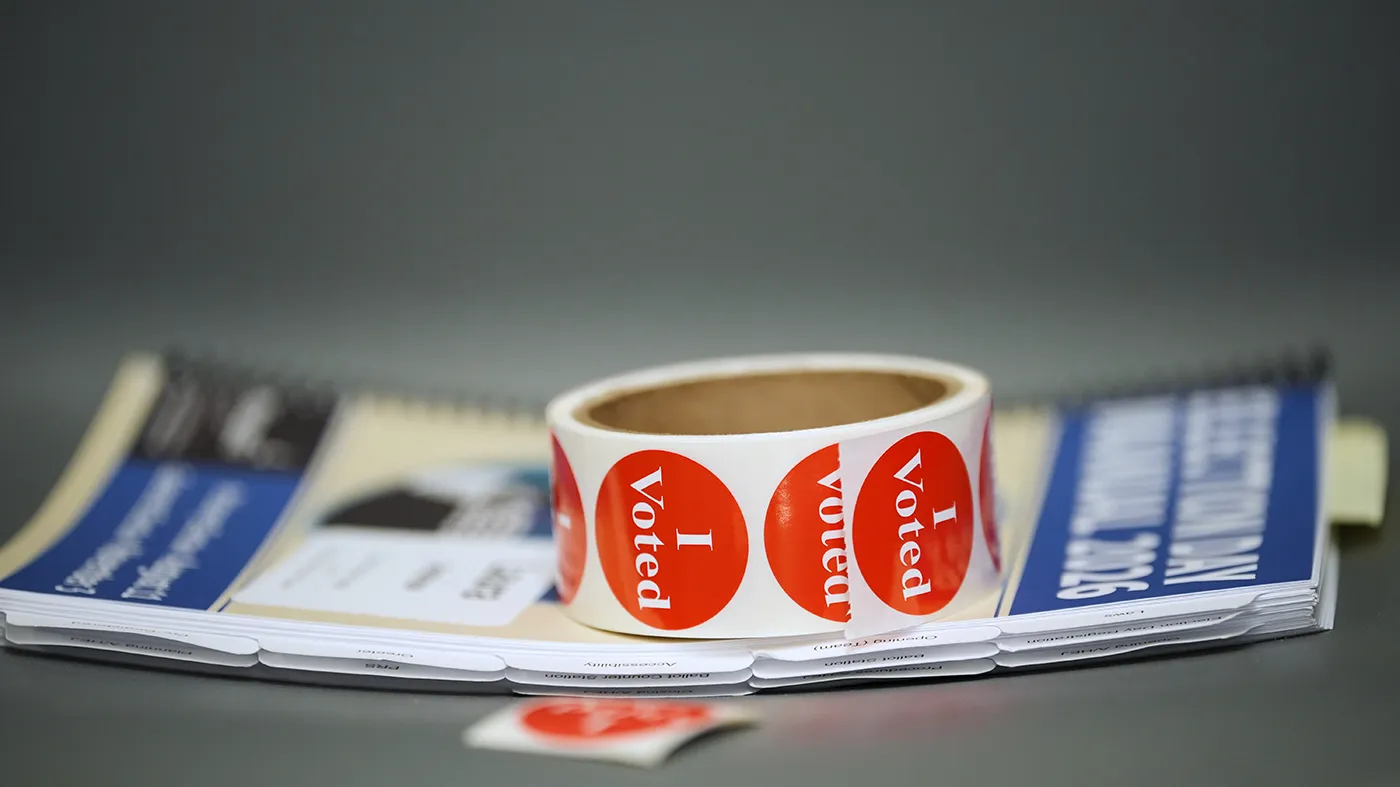 Stickers are placed on a table at a voting location on primary Election Day Tuesday, Aug. 11, 2026, in Minneapolis.