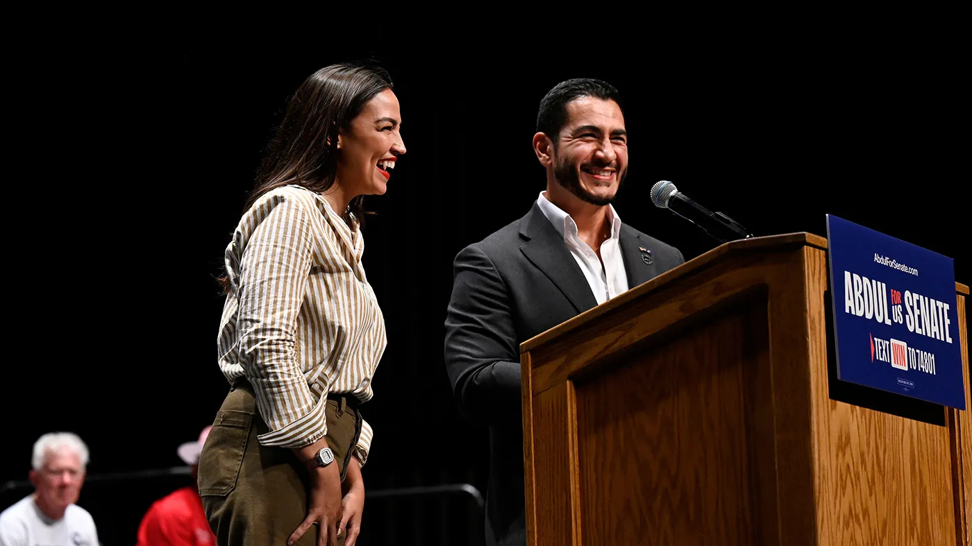 Michigan Democratic U.S. Senate primary candidate Abdul El-Sayed, right, is joined on stage by Rep. Alexandria Ocasio-Cortez (D-N.Y.) during a campaign rally, July 18, 2026, in Detroit.