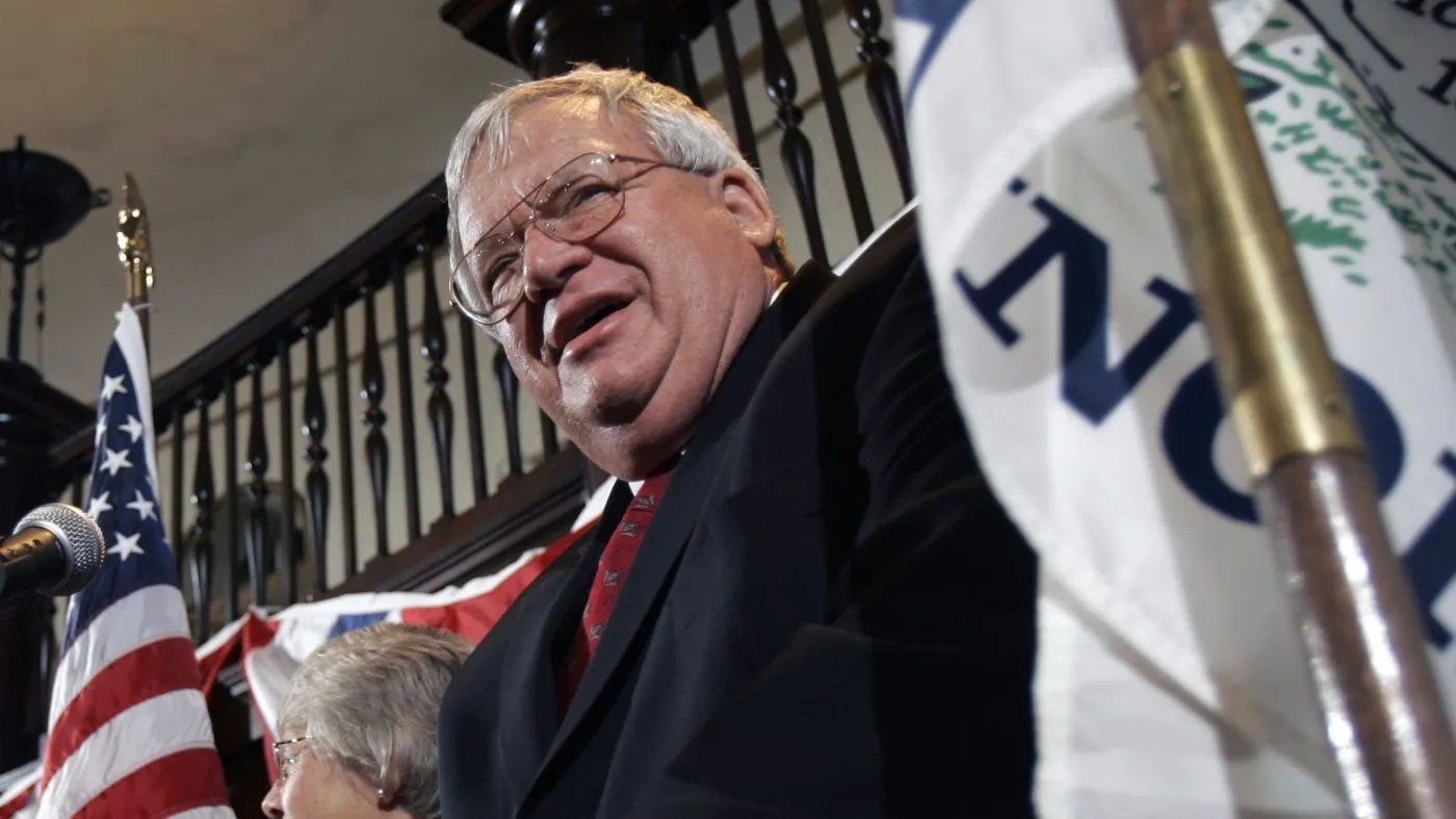 Ex-House Speaker Rep. Dennis Hastert, R-Ill., right, stands at the podium on Tuesday, Nov. 7, 2006 in St. Charles, Ill. (AP Photo/Jeff Roberson)
