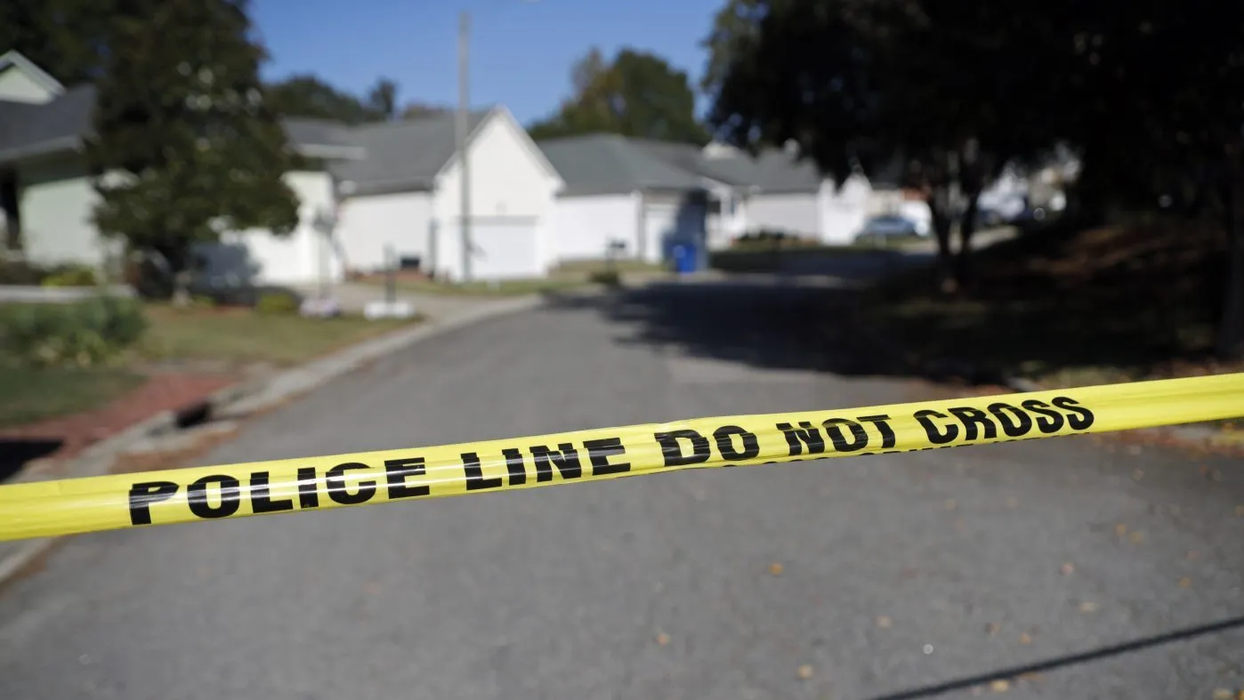 FILE – Sahalee Way is closed off, except for residents, on Oct. 14, 2022, following a shooting on Oct. 13, in Raleigh, N.C. The city of Raleigh released body cam footage on Thursday, Dec. 1, 2022 that was recorded by police officers shortly before they apprehended a suspect in a fatal October shooting in Raleigh.