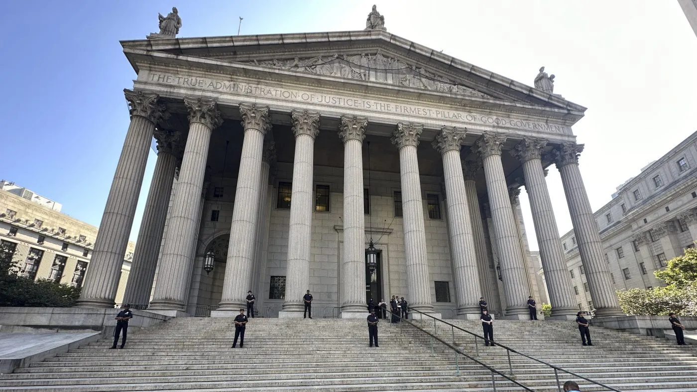FILE – Law enforcement stand outside the New York State Supreme Court Building in New York City on Oct. 2, 2023. (AP Photo/Ted Shaffrey, File)