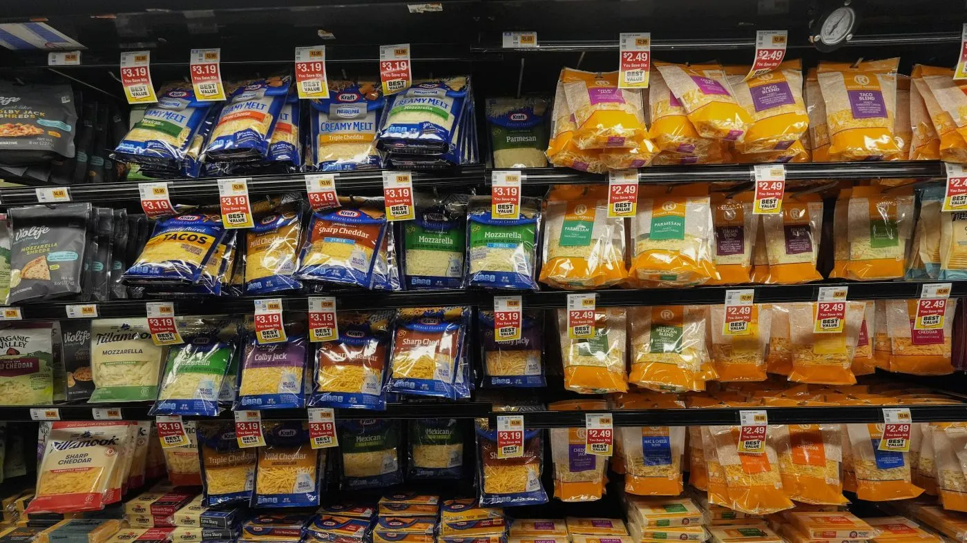 Cheese products in plastic packaging line the cooler at a grocery store in New Orleans, Wednesday, April 17, 2024. People are increasingly breathing, eating and drinking tiny particles of plastic, however, there are simple things people can do at the grocery store if they want to use less plastic. (AP Photo/Gerald Herbert)