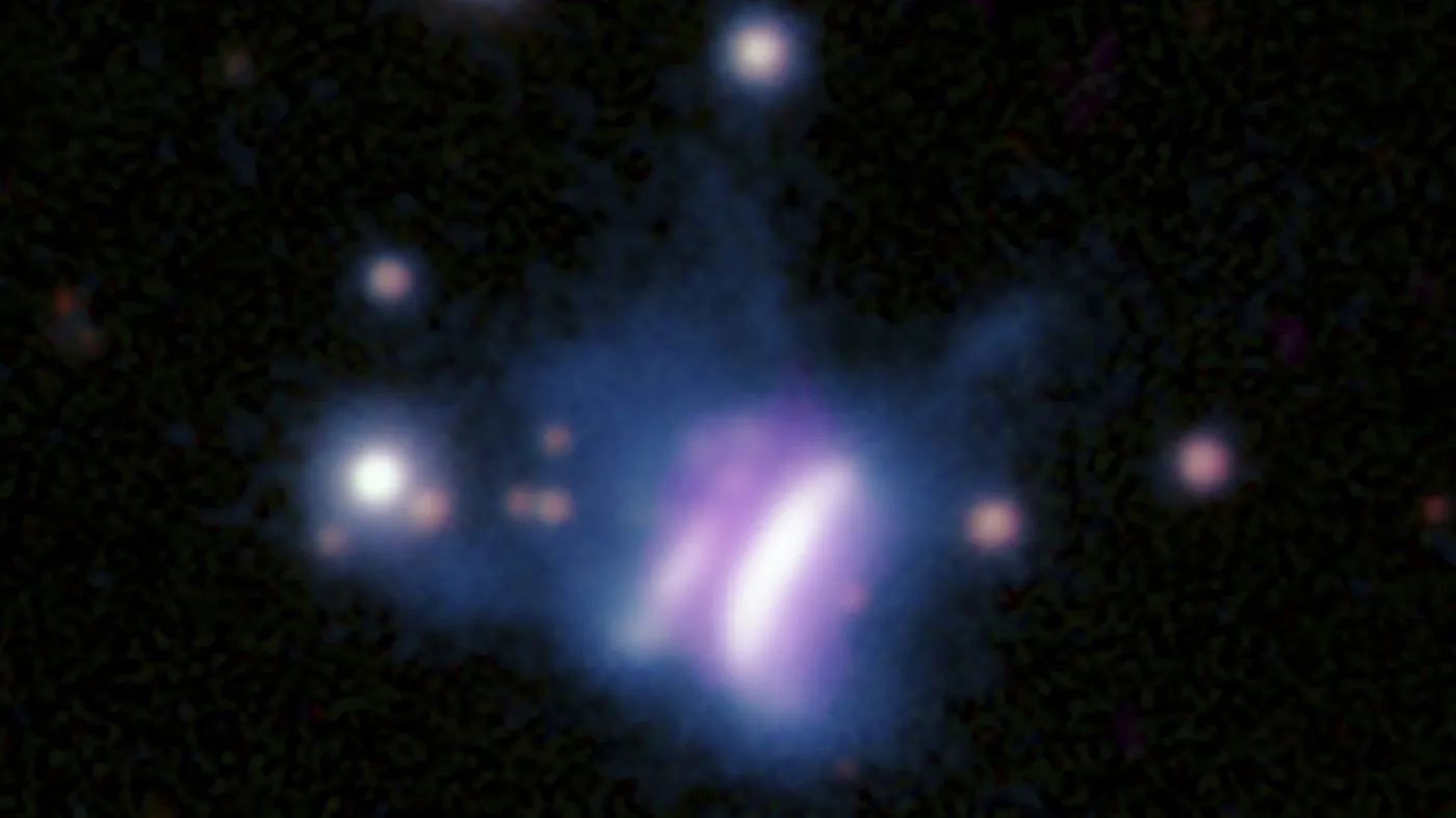 This composite radio and optical image provided by researchers in May 2024 shows IRAS 23077, center, a planet-forming disk, and several surrounding stars. The star at the center of IRAS 23077 is not visible because its light is blocked by its surrounding disk, which is viewed from the side. The diameter of this colossal disk is roughly 3,300 times the distance between Earth and the sun, with enough gas and dust to form super-sized planets in far-flung orbits, the U.S. and German researchers reported in May 2024. (Radio: SAO/ASIAA/SMA/K. Monsch et al; Optical: Pan-STARRS via AP)