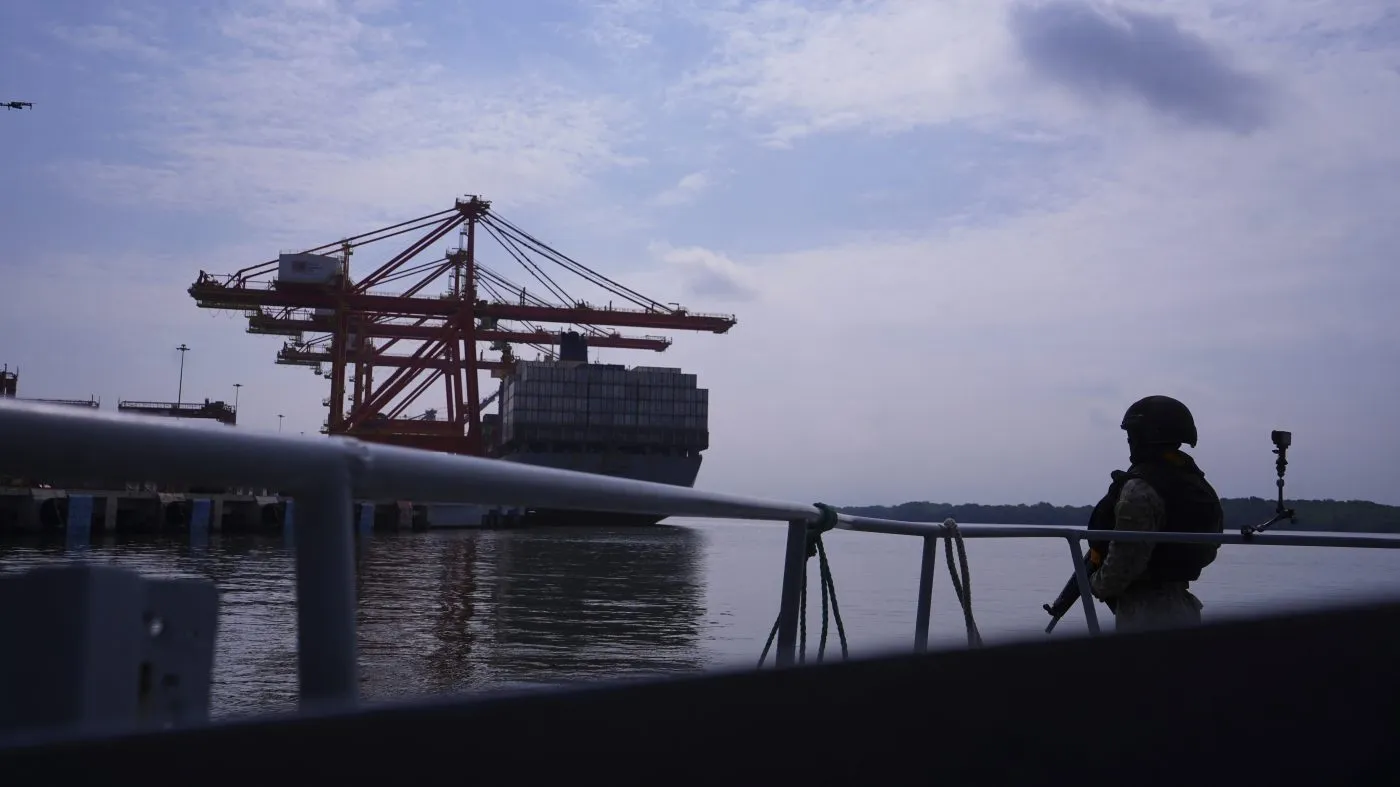 A soldier stands guard at ​​the Contecon sea port in Guayaquil, Ecuador, Wednesday, Feb. 5, 2025. (AP Photo/Cesar Munoz)