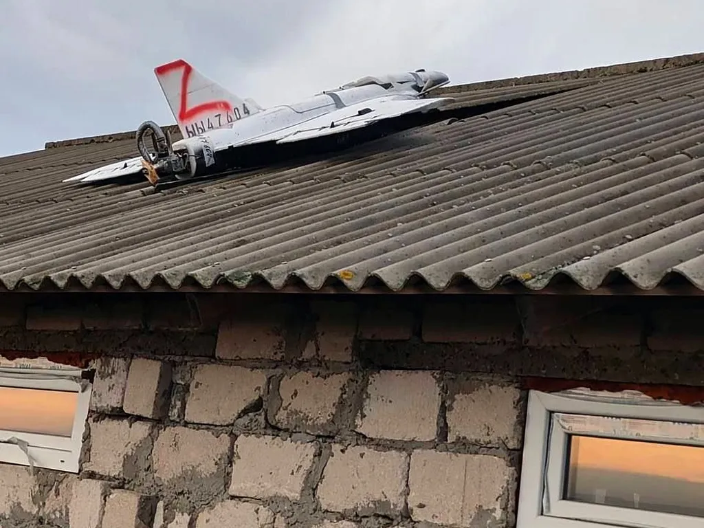 This image released by Moldova’s Police on Tuesday, Nov. 25, 2025, shows a drone on the roof of a house in the village of Cuhurestii de Jos, northern Moldova, following Russian air attacks on Ukraine. (Moldova Police via AP)
