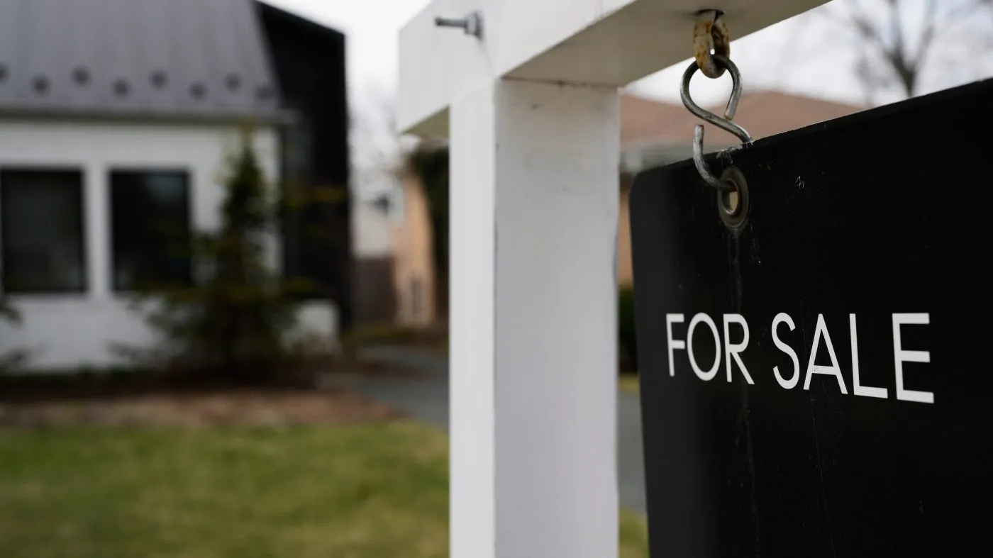 A “house for sale” sign is displayed in front of a home in Evanston, Ill., March 25, 2026.