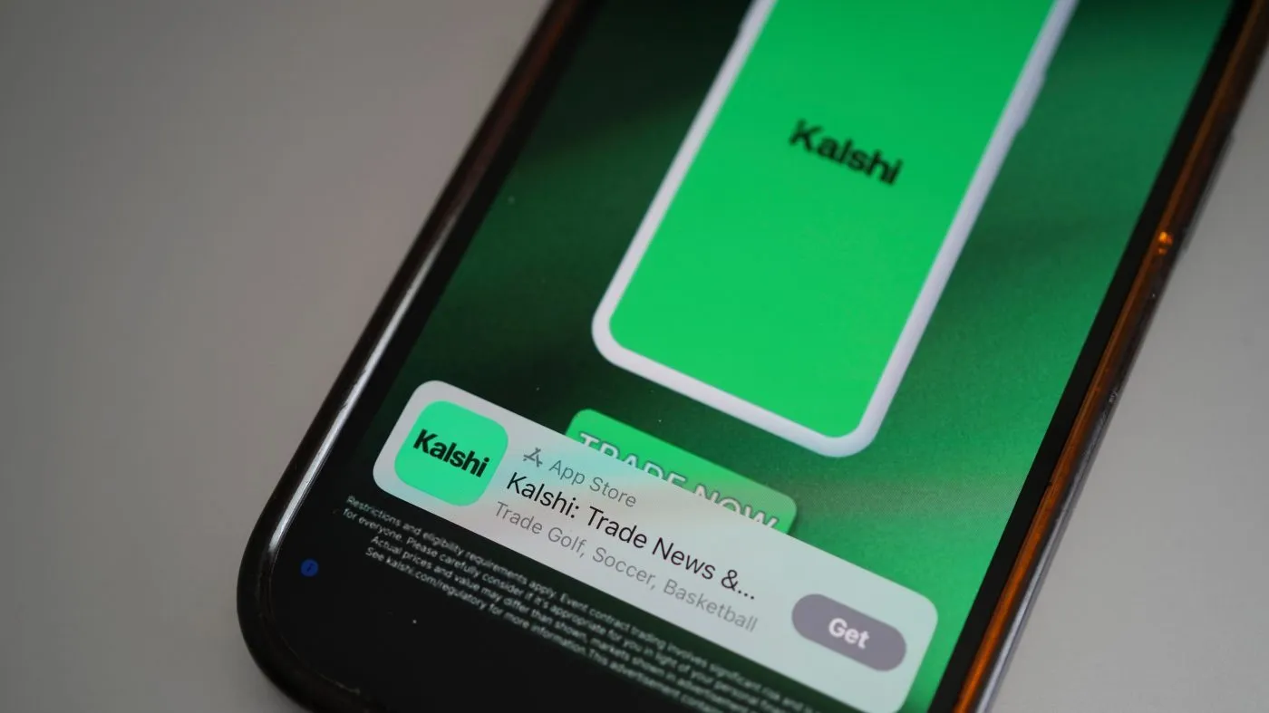 An ad for the prediction market app Kalshi is displayed on a mobile phone Thursday, April 16, 2026, in Chicago. (AP Photo/Erin Hooley)