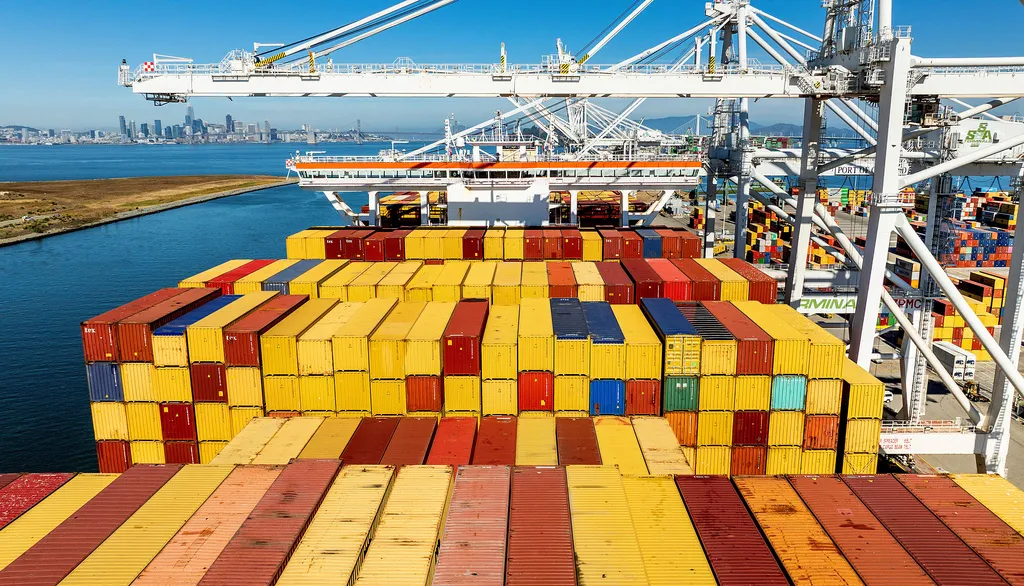Cargo containers line a ship at the Port of Oakland on Aug. 6, 2025, in Oakland, Calif.