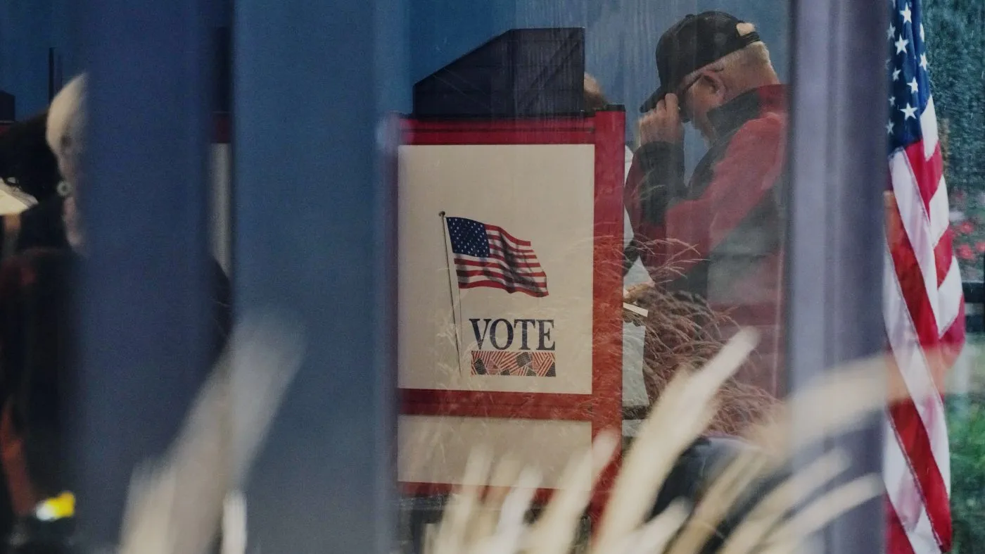 A voter casts a ballot on the first day of early voting in Minnesota at the Elections & Voter Services building, Sept. 18, 2026, in Minneapolis.