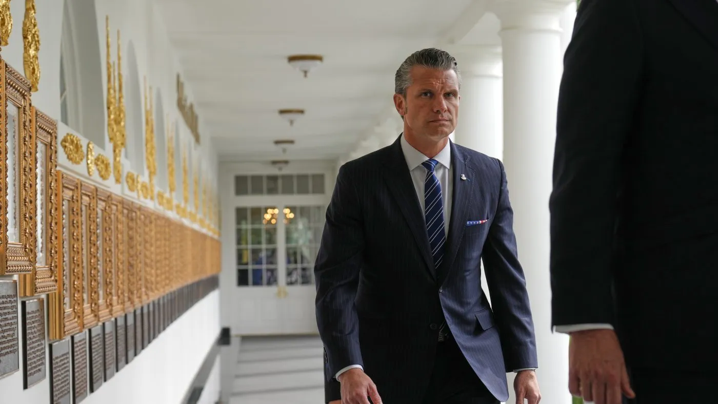 Defense Secretary Pete Hegseth walks along the Colonnade before President Trump and Chinese President Xi Jinping at the White House on Sept. 24, 2026, in Washington.