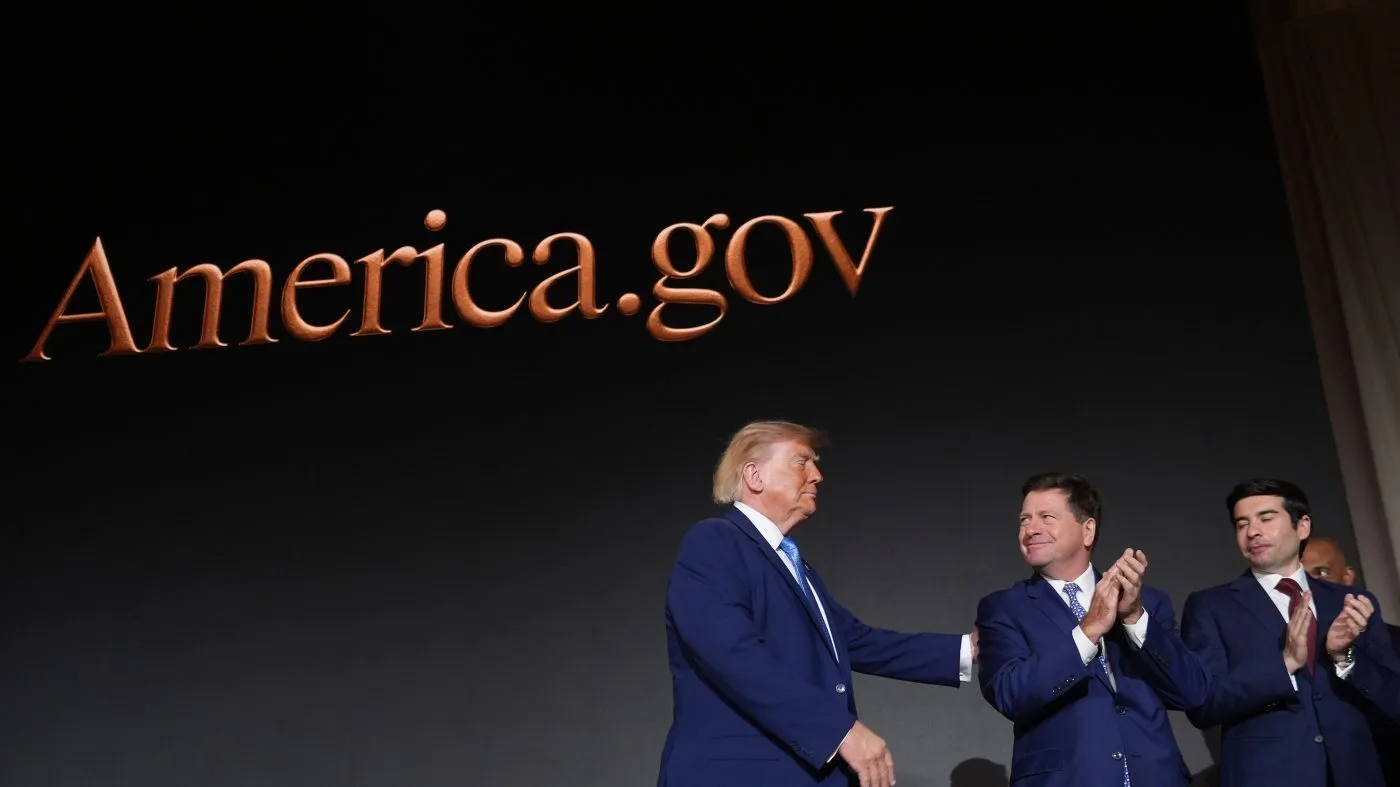 President Donald Trump on stage with Dir. of National Intelligence Jay Clayton, second from the right, and Sec. of Labor Keith E. Sonderling, far right, after speaking at the Andrew W. Mellon Auditorium, Tuesday, Sept. 29, 2026, in Washington. (AP Photo/Alex Brandon)