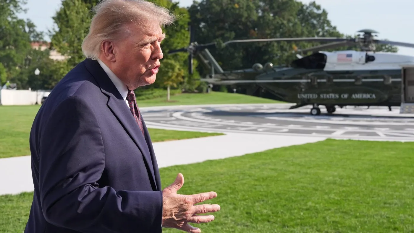 President Trump speaks with reporters before departing on Marine One from the South Lawn of the White House, Oct. 2, 2026, in Washington.
