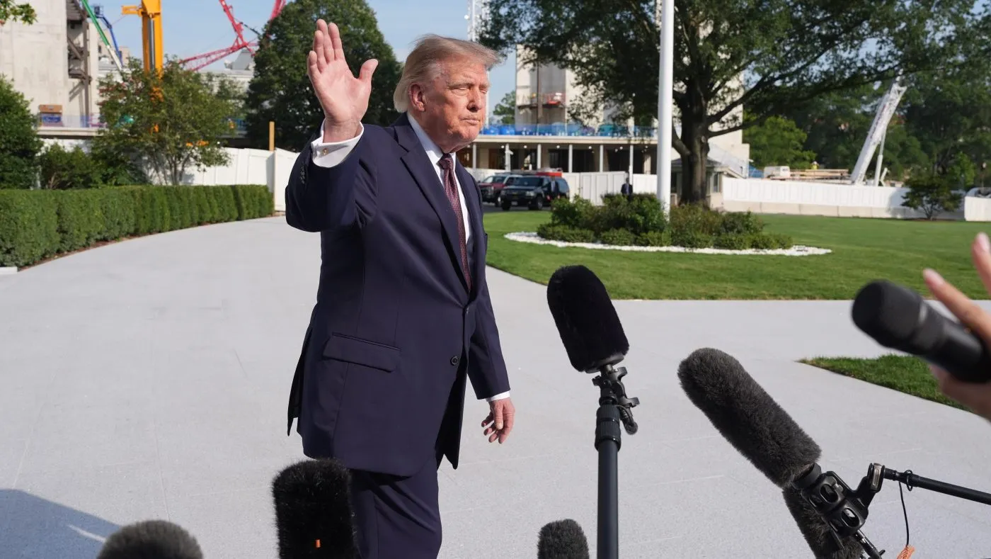 President Trump speaks with reporters before departing on Marine One from the South Lawn of the White House, Oct. 2, 2026, in Washington.