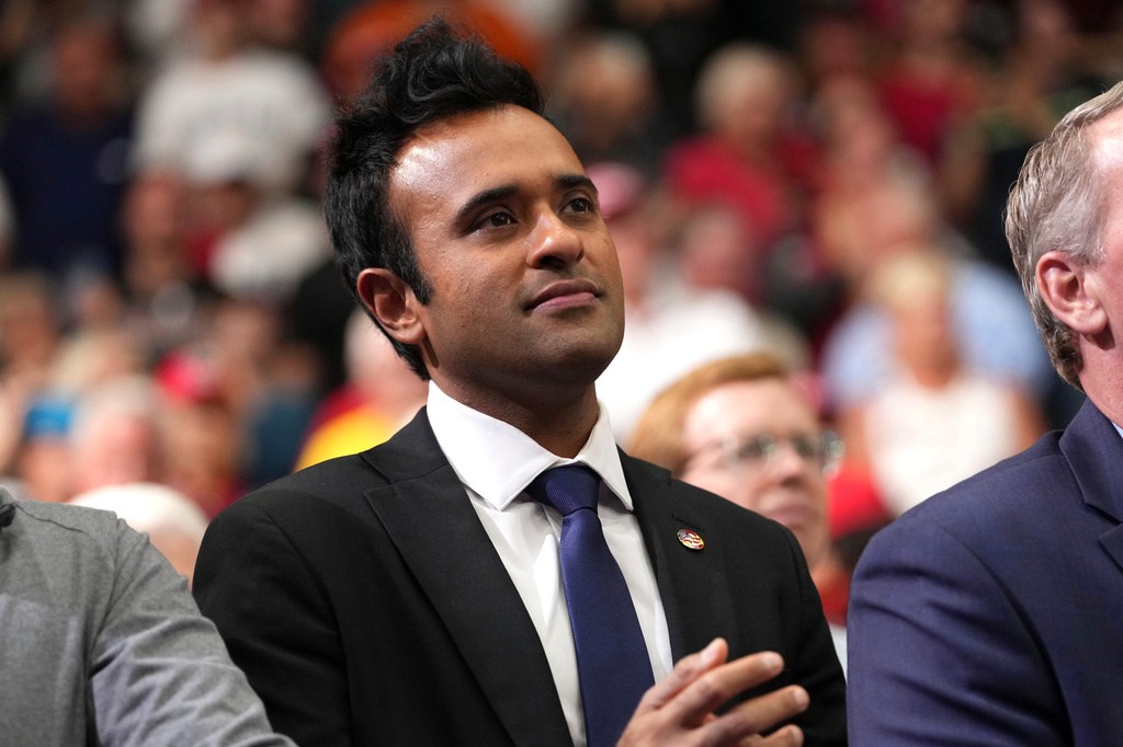 Ohio Republican gubernatorial candidate Vivek Ramaswamy listens as President Donald Trump speaks during a midterm election rally, Saturday, Oct. 3, 2026, in Vandalia, Ohio. (AP PhotoMark Schiefelbein)