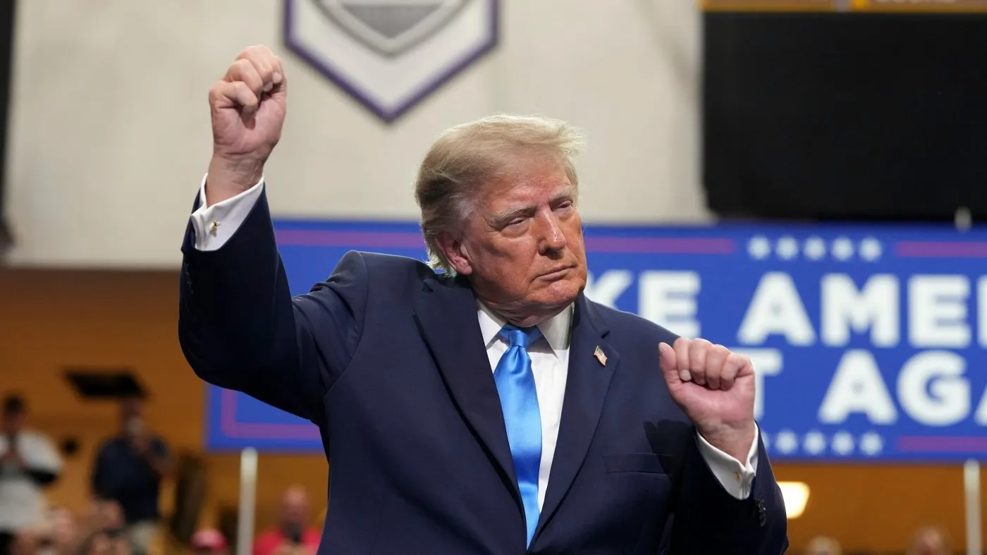 President Donald Trump dances as he departs after speaking during an event at Butler High School in Vandalia, Ohio, Saturday, Oct. 3, 2026. (AP Photo/Mark Schiefelbein)