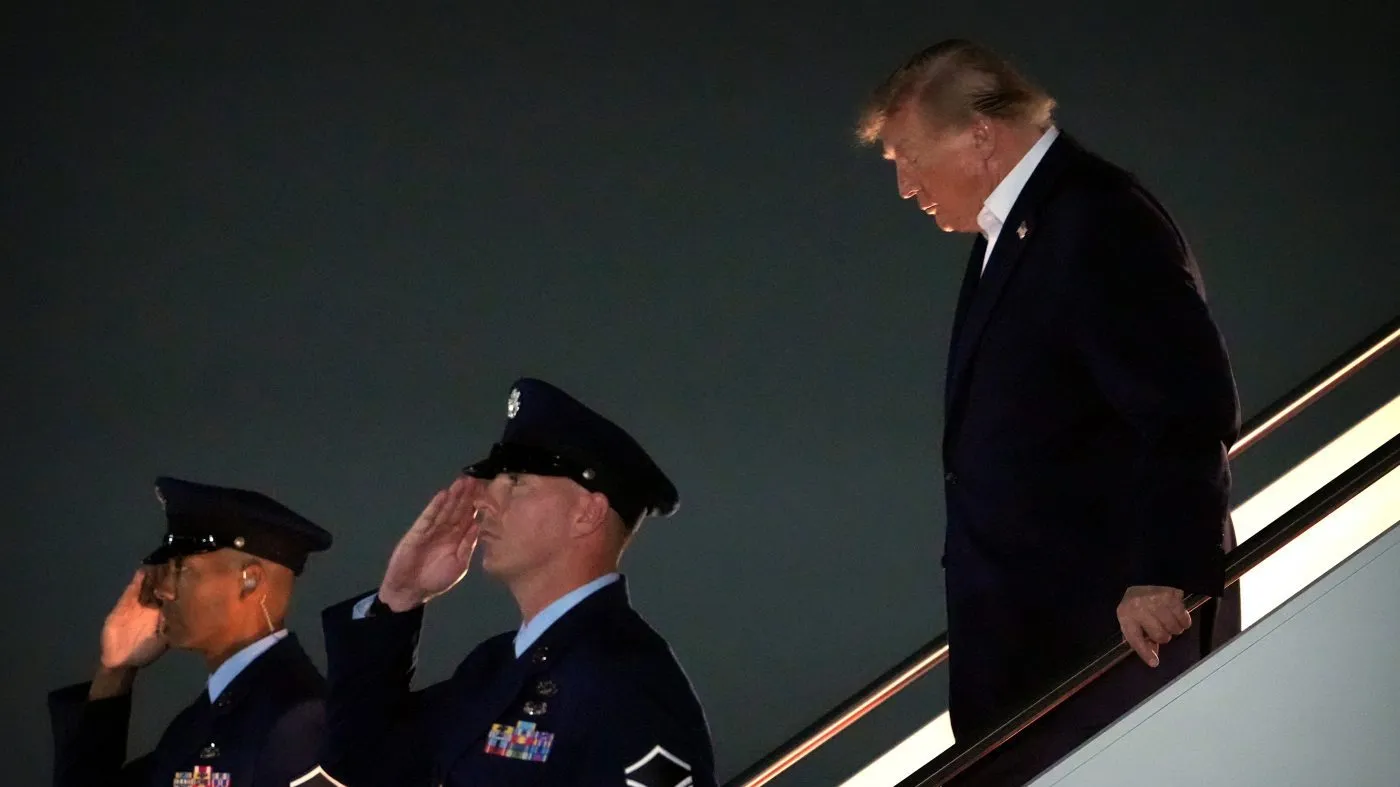 President Donald Trump steps off Air Force One, Saturday, Oct. 3, 2026, at Joint Base Andrews, Md. (AP Photo/Mark Schiefelbein)