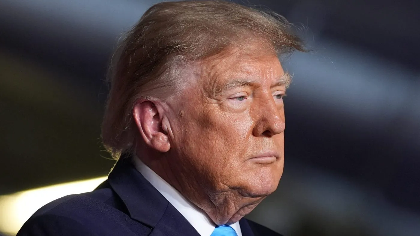 President Donald Trump displays a signed executive order at a campaign rally at the Pinnacle Bank Expo Center, Monday, Oct. 5, 2026, in Grand Island, Neb. (AP Photo/Alex Brandon)
