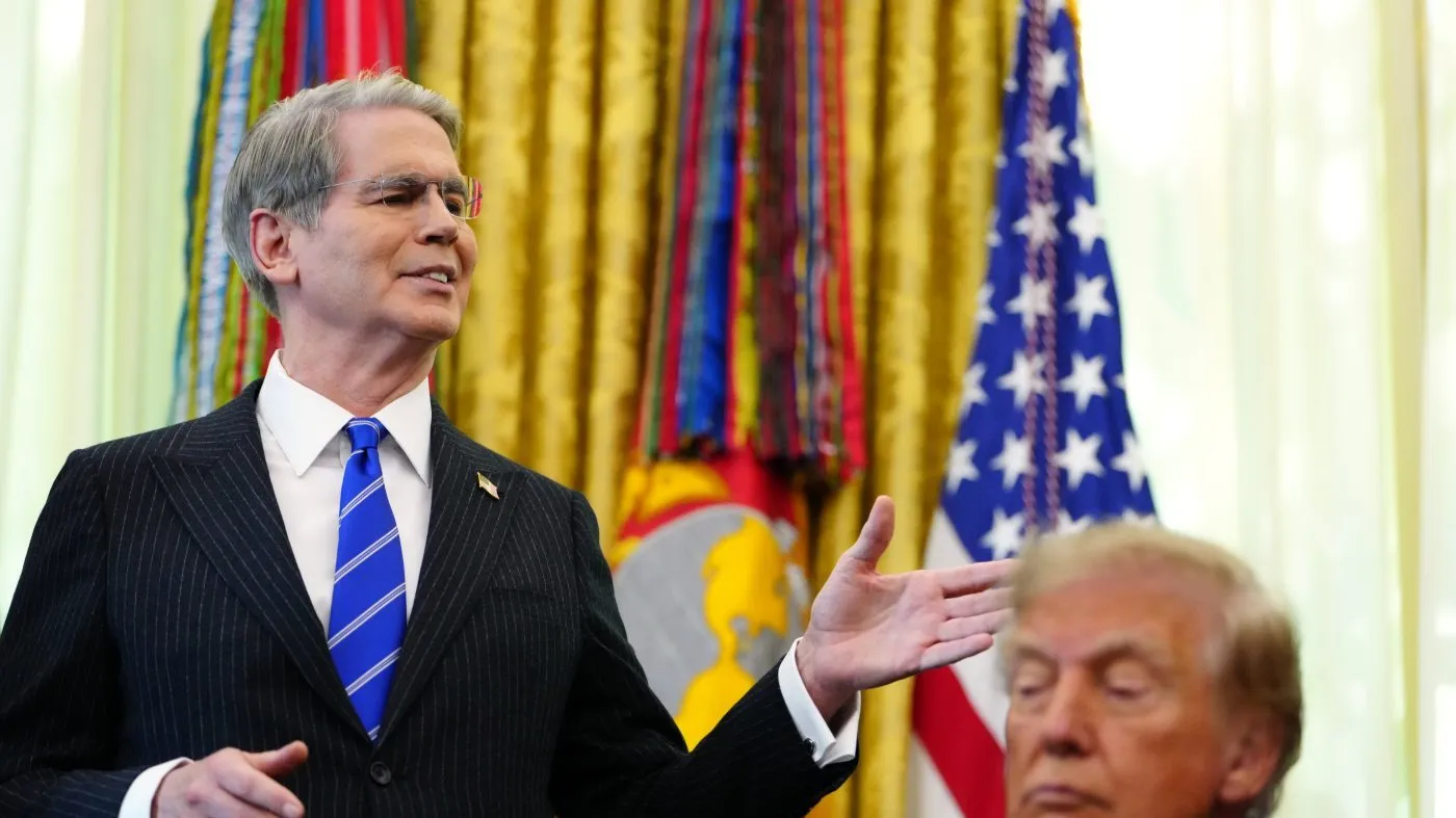 President Donald Trump listens as Treasury Secretary Scott Bessent speaks in the Oval Office of the White House, Wednesday, Oct. 7, 2026, in Washington. (AP Photo/Julia Demaree Nikhinson)