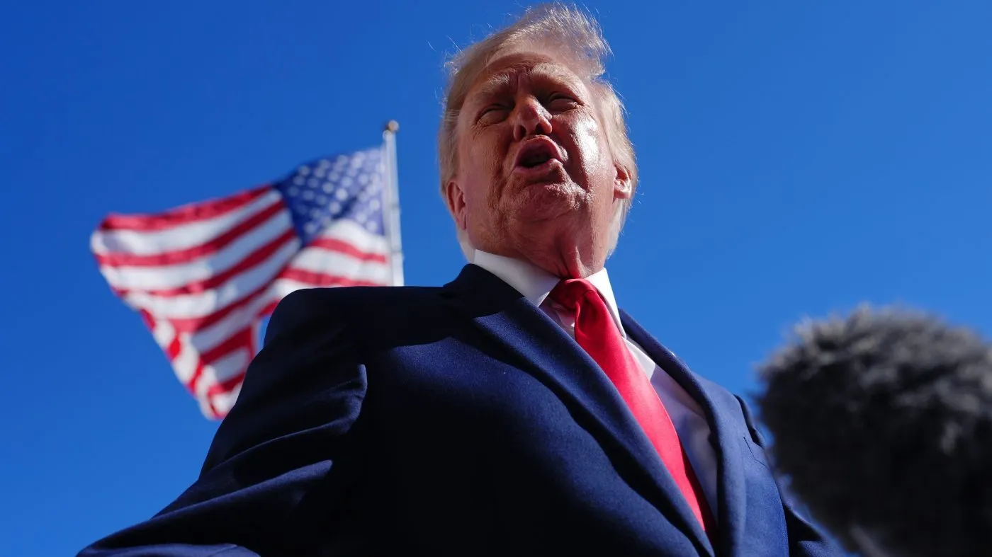 President Donald Trump talks to reporters before boarding Marine One on the South Lawn of the White House, Wednesday, Oct. 7, 2026, in Washington. (AP Photo/Julia Demaree Nikhinson)