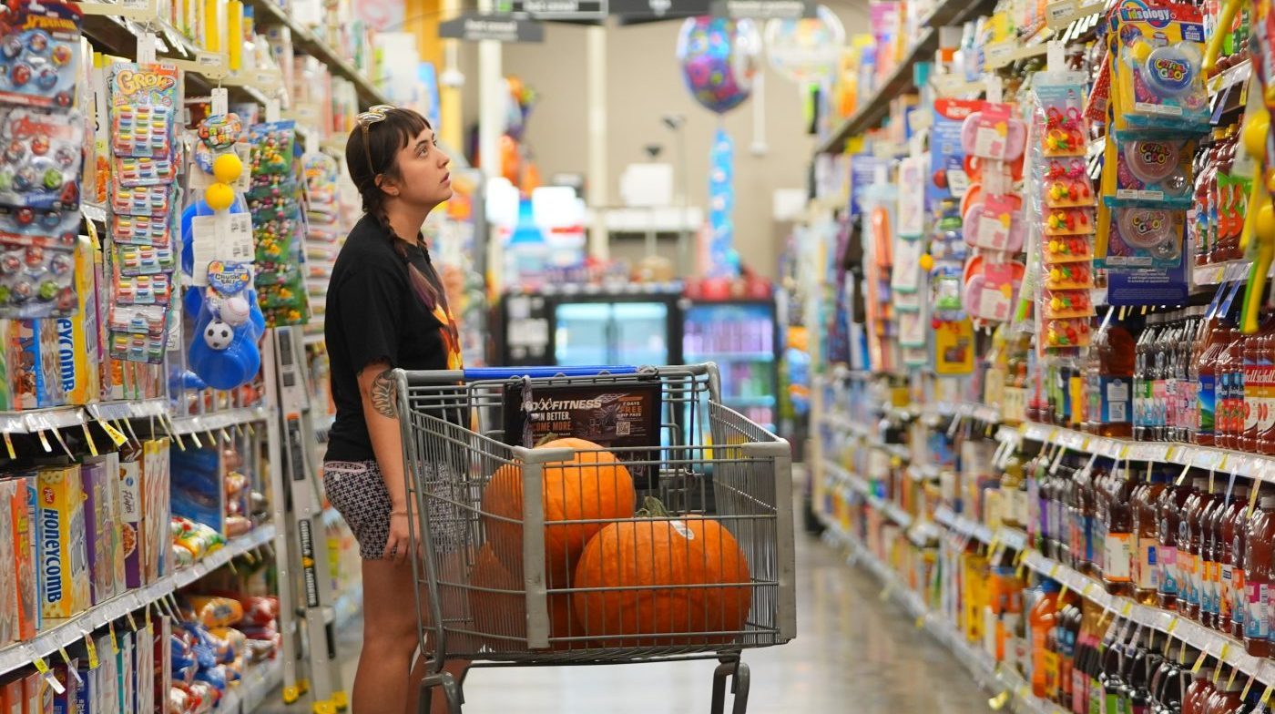 A shopper looks at items in an aisle at a grocery store in Fort Worth, Texas, Wednesday, Oct. 7, 2026. (AP Photo/LM Otero)
