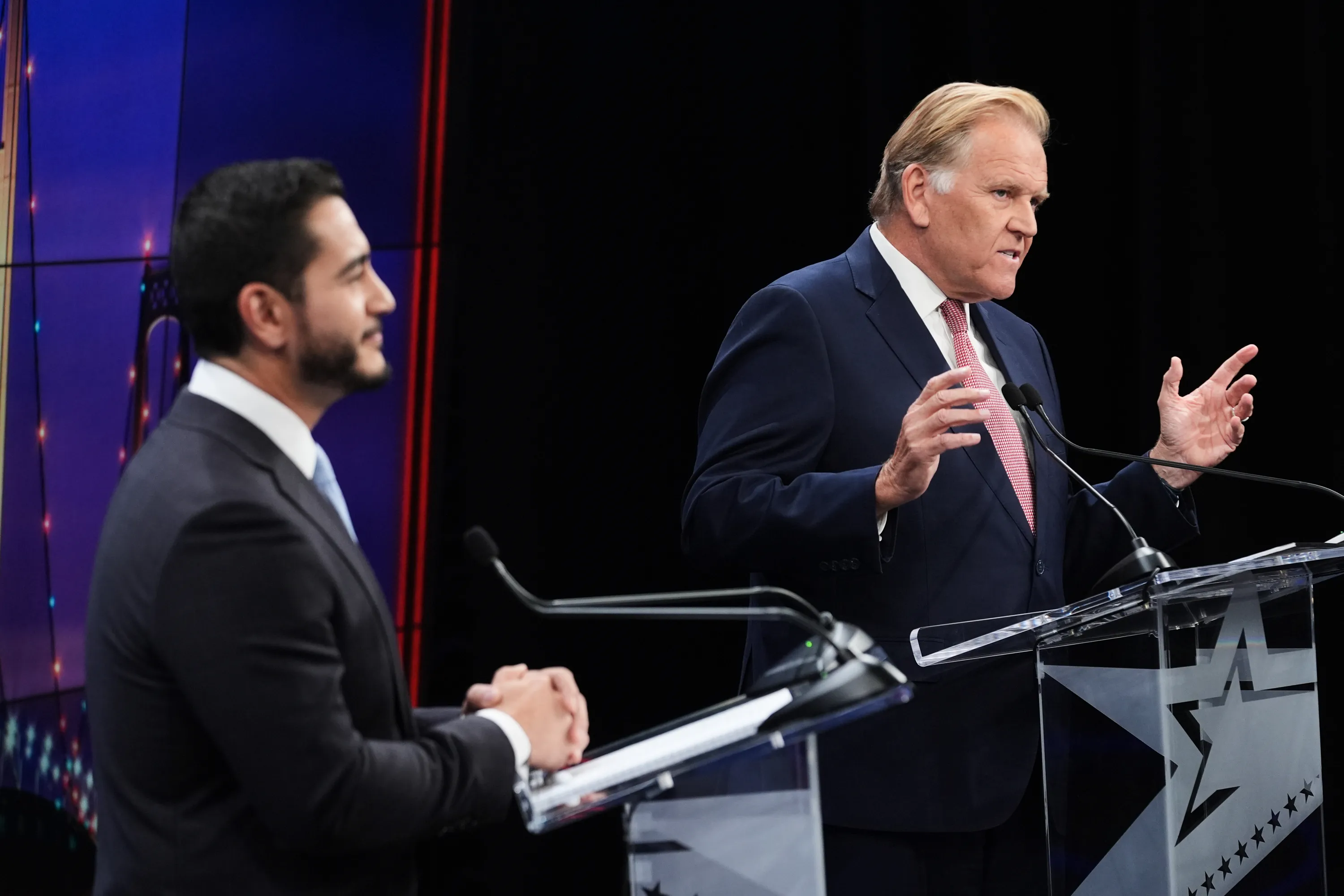 Republican nominee for U.S. Senate Mike Rogers, right, speaks during a televised debate with Democratic nominee for U.S. Senate Abdul El-Sayed, at WOOD-TV, on Thursday, Oct. 8, 2026, in Grand Rapids, Mich. (AP Photo/Paul Sancya, Pool)