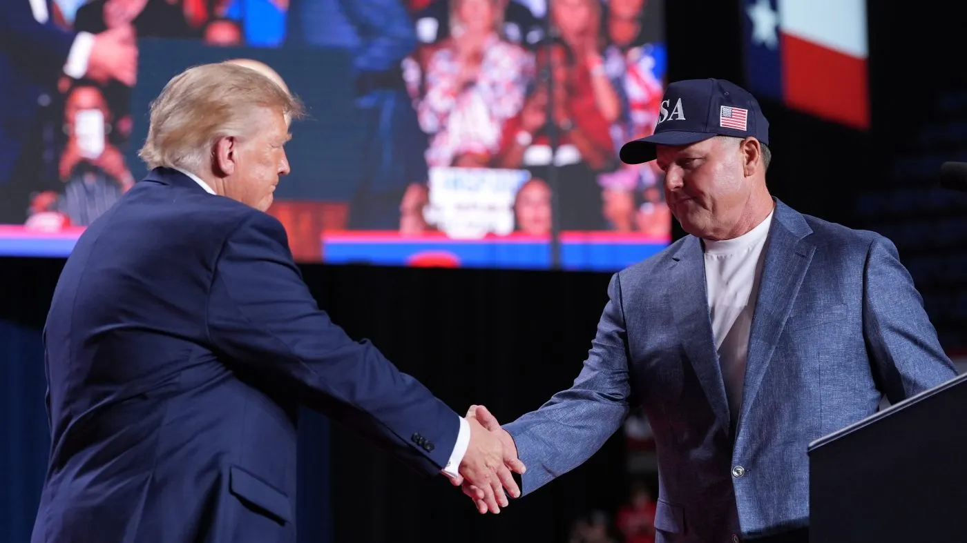 President Donald Trump greets Roger Clemens at a campaign rally at the Freeman Coliseum in San Antonio, Wednesday, Oct. 7, 2026.