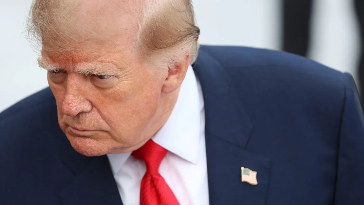 President Donald Trump speaks with reporters before departing on Marine One from the South Lawn of the White House, Friday, Oct. 9, 2026, in Washington. (AP Photo/Tom Brenner)
