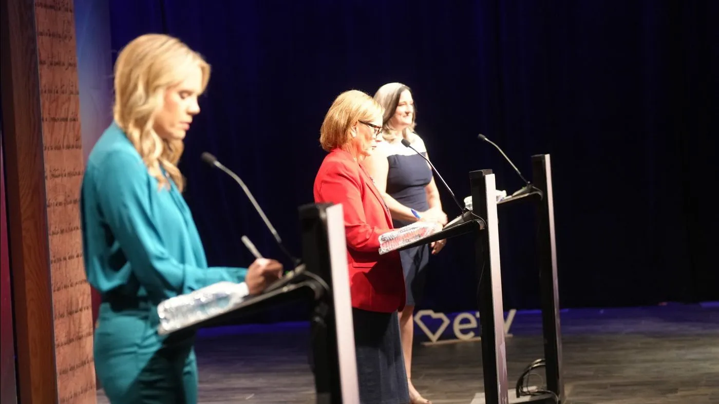 From left, Dr. Annie Andrews, Democratic nominee for Senate in South Carolina, Sen. Darline Graham, R-S.C., and Libertarian candidate Kasie Whitener ready for a debate Sunday, Oct. 11, 2026, in Columbia, S.C. (AP Photo/Meg Kinnard)