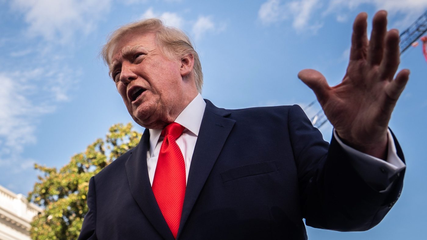 President Trump gestures while speaking to reporters before boarding Marine One on the South Lawn of the White House, Oct. 12, 2026, in Washington. (AP Photo/Julia Demaree Nikhinson)