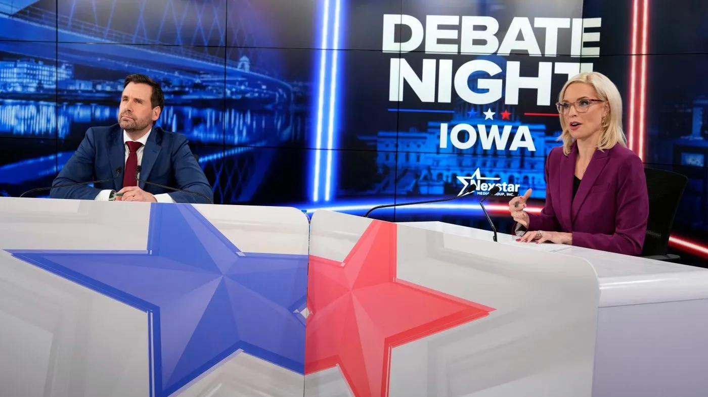 Republican nominee for U.S. Senate Ashley Hinson, right, speaks during a televised debate with Democratic nominee for U.S. Senate Josh Turek at WHO 13, Tuesday, Oct. 13, 2026, in Des Moines, Iowa. (AP Photo/Charlie Neibergall)