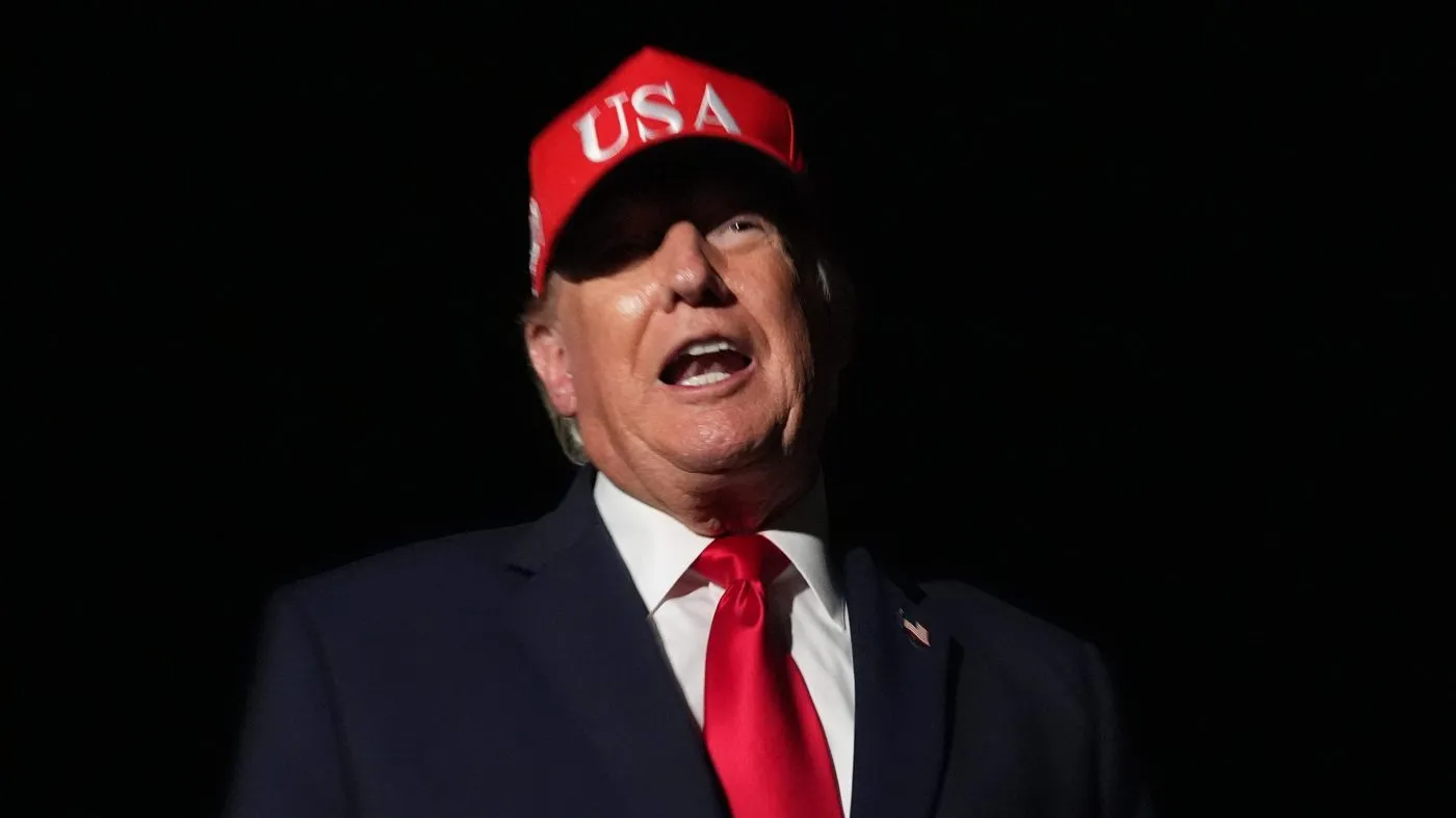 President Trump talks with reporters before switching to the larger Air Force One at Missoula International Airport for the trip back to Washington, Oct. 14, 2026, in Missoula, Mont.