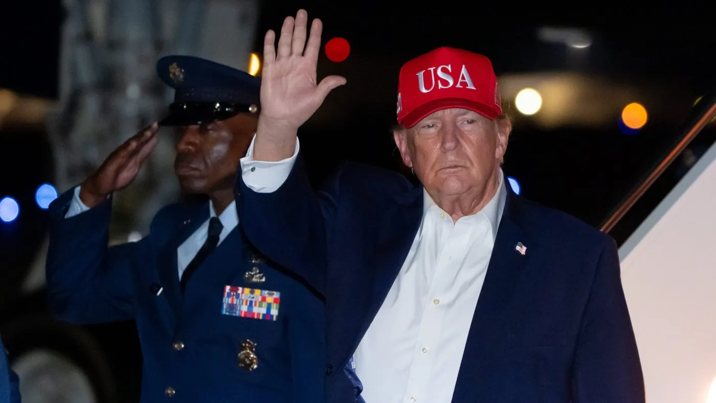 President Donald Trump waves as he arrives on Air Force One, Thursday, Oct. 15, 2026, at Joint Base Andrews, Md. (AP Photo/Alex Brandon)