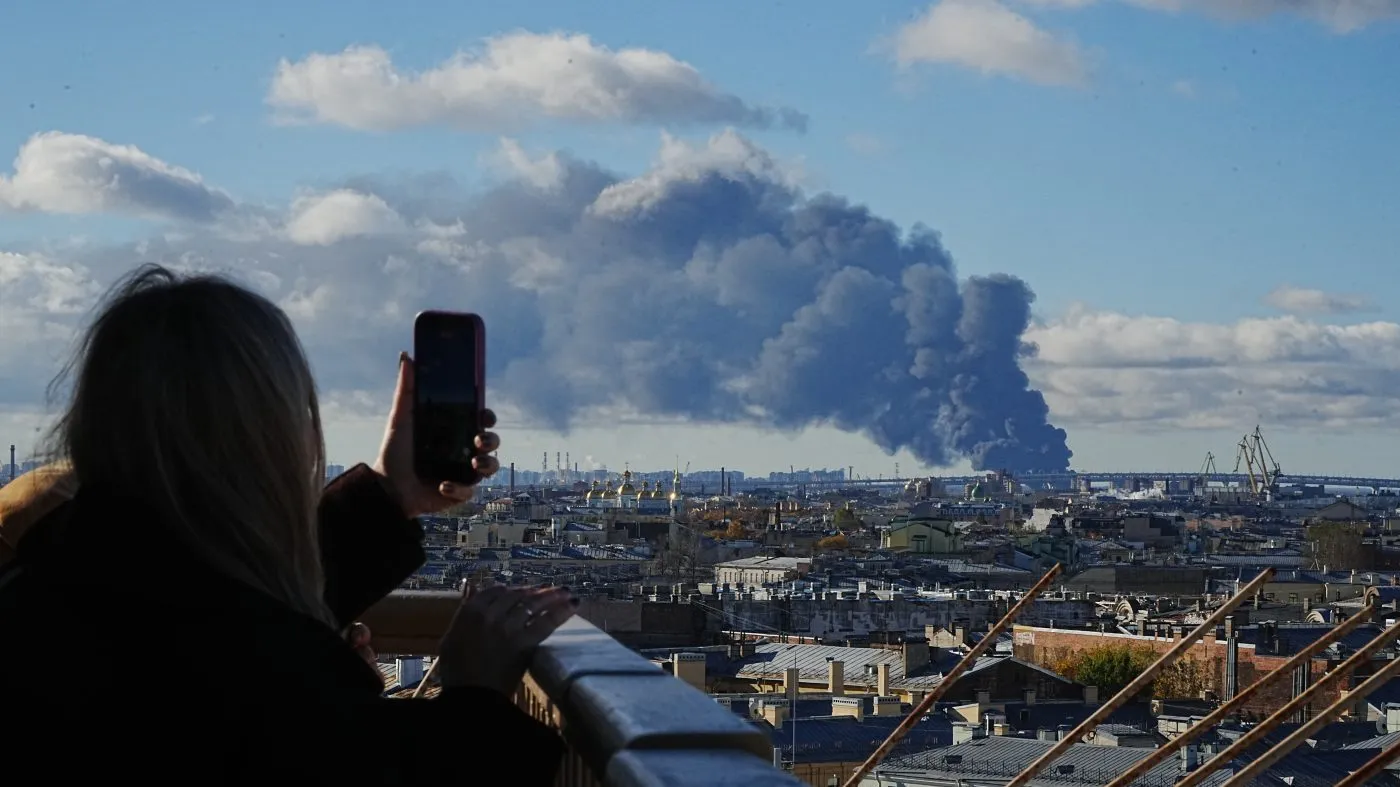 Smoke billows into the sky following Ukrainian drone strikes on an industrial zone in St. Petersburg, Russia, on Sunday, Oct. 18, 2026. (UGC via AP)