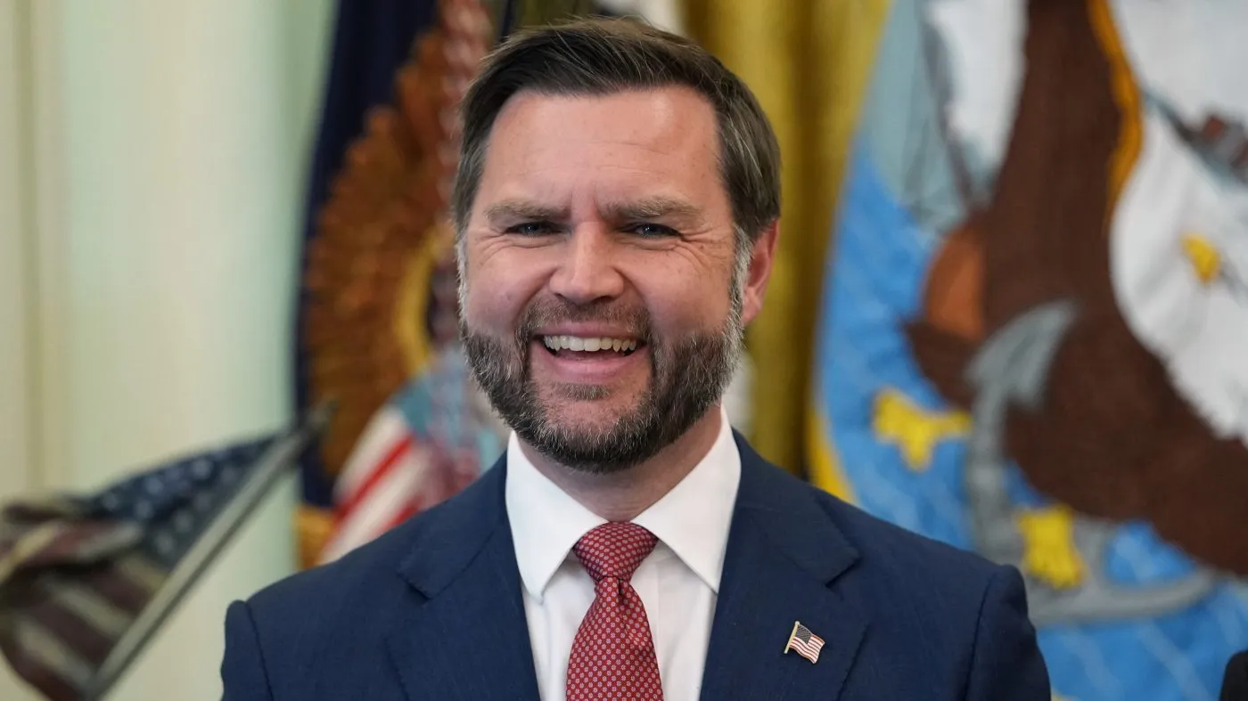Vice President JD Vance smiles as President Donald Trump speaks in the Oval Office of the White House, Tuesday, Oct. 20, 2026, in Washington. (AP Photo/Jacquelyn Martin)