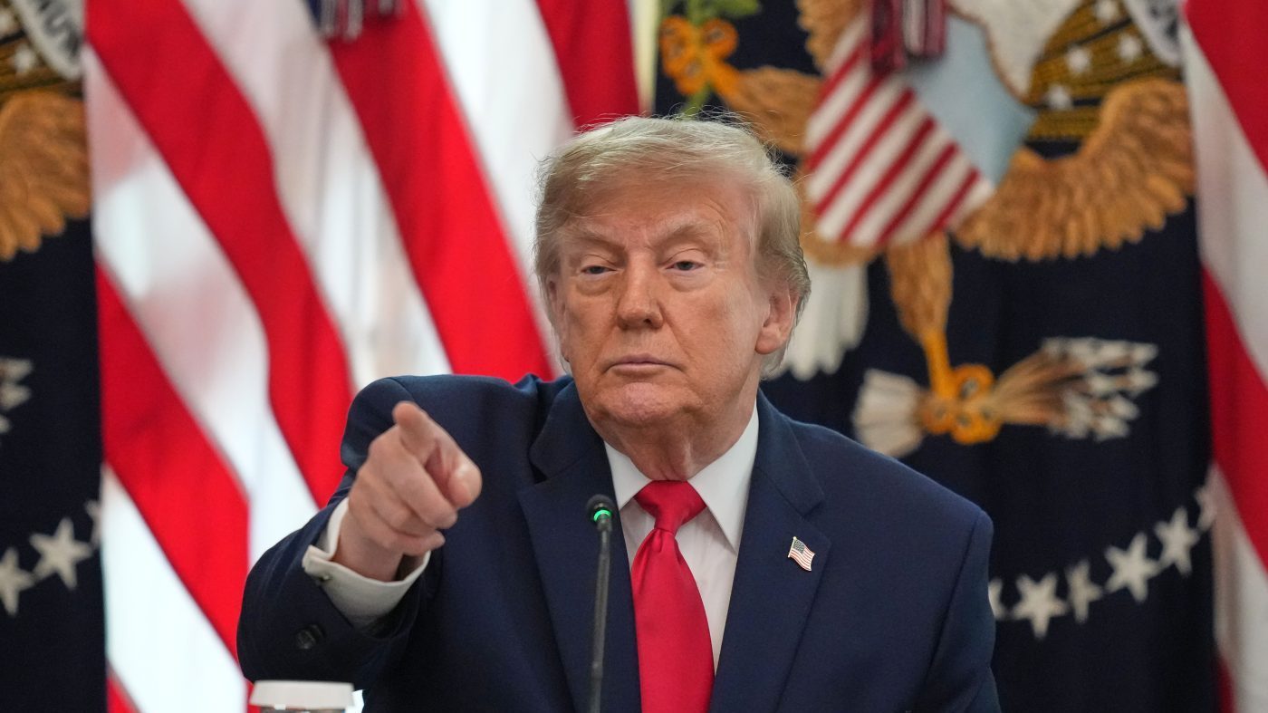 President Donald Trump points to a reporter to ask a question as he speaks at a roundtable event in the East Room of the White House, Wednesday, Oct. 21, 2026, in Washington. (AP Photo/Alex Brandon)