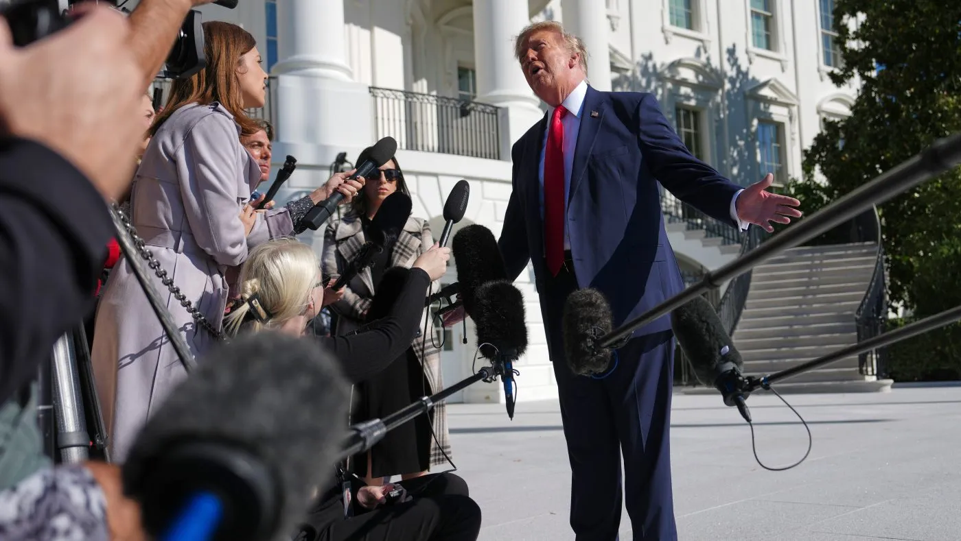 President Donald Trump speaks with reporters before boarding Marine One on the South Lawn of the White House, Friday, Oct. 23, 2026, in Washington. (AP Photo/Julia Demaree Nikhinson)