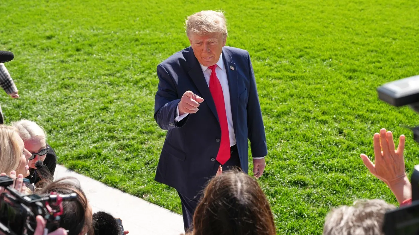 President Trump speaks with reporters before departing on Marine One from the South Lawn of the White House, Oct. 23, 2026, in Washington.
