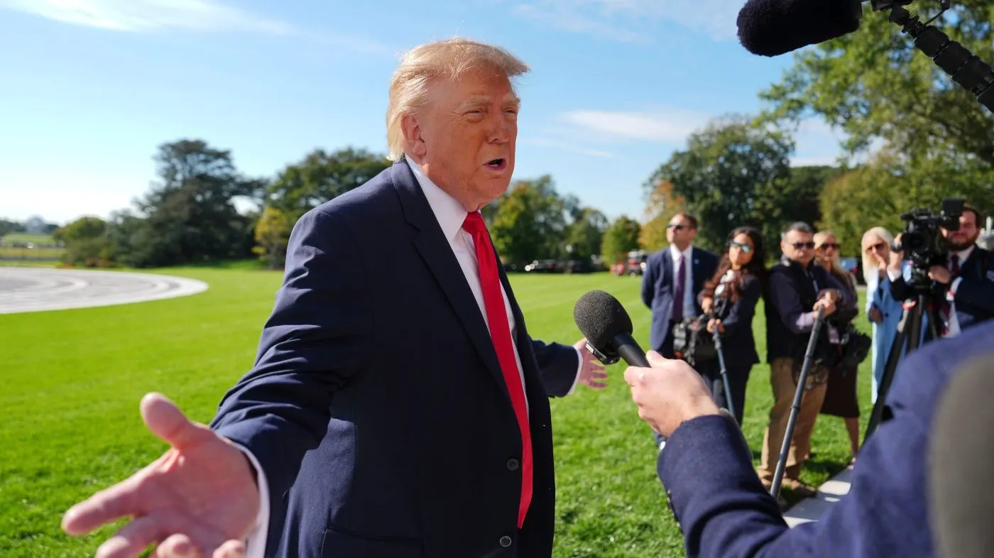 President Donald Trump speaks with reporters before boarding Marine One on the South Lawn of the White House, Friday, Oct. 23, 2026, in Washington. (AP Photo/Julia Demaree Nikhinson)