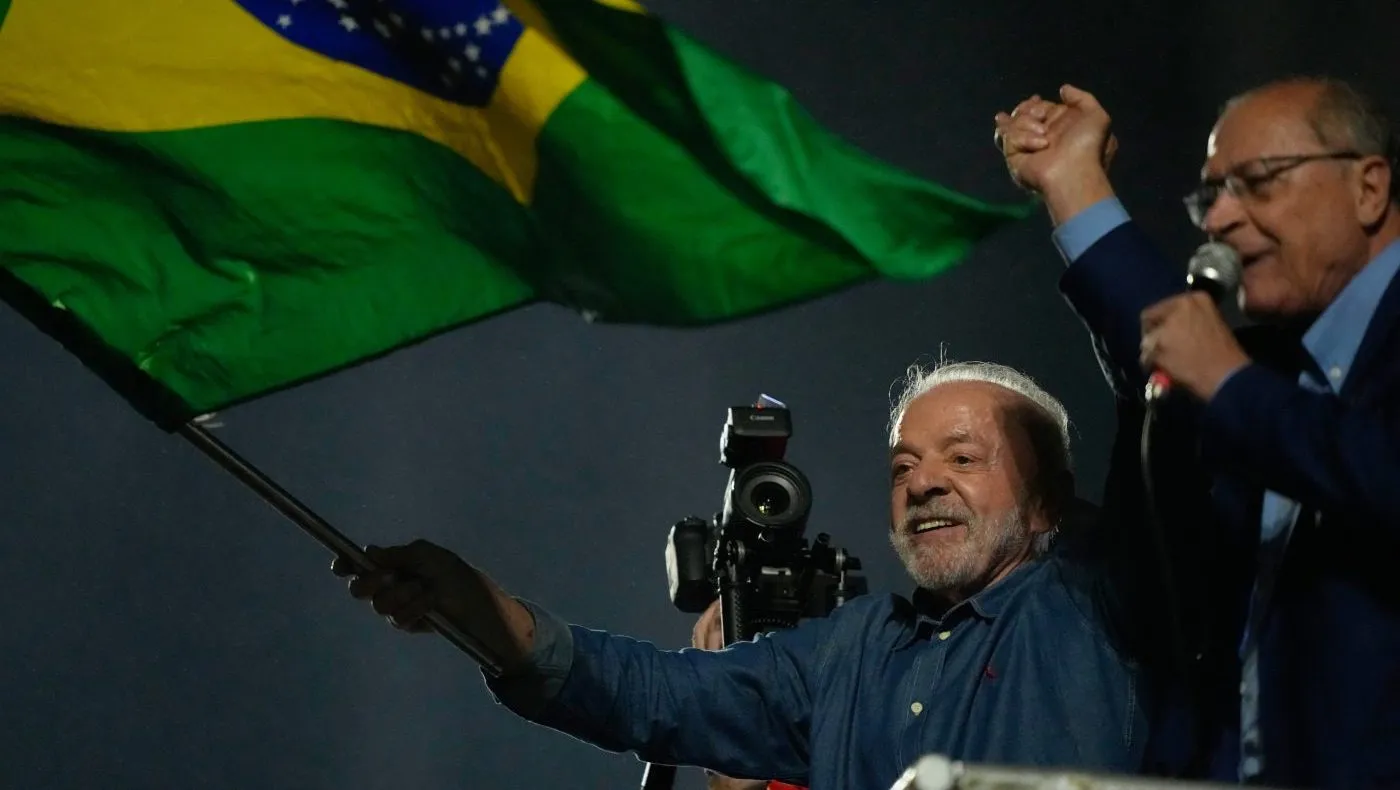President Luiz Inacio Lula da Silva and his running mate Geraldo Alckmin address supporters during a victory rally after winning the presidential runoff in Sao Paulo, Brazil, Sunday, Oct. 25, 2026. (AP Photo/Natacha Pisarenko)